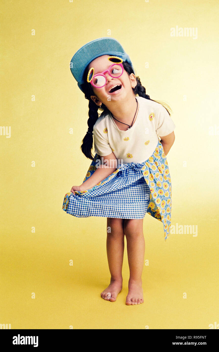 Girl child wearing funny glasses and cap Stock Photo Alamy