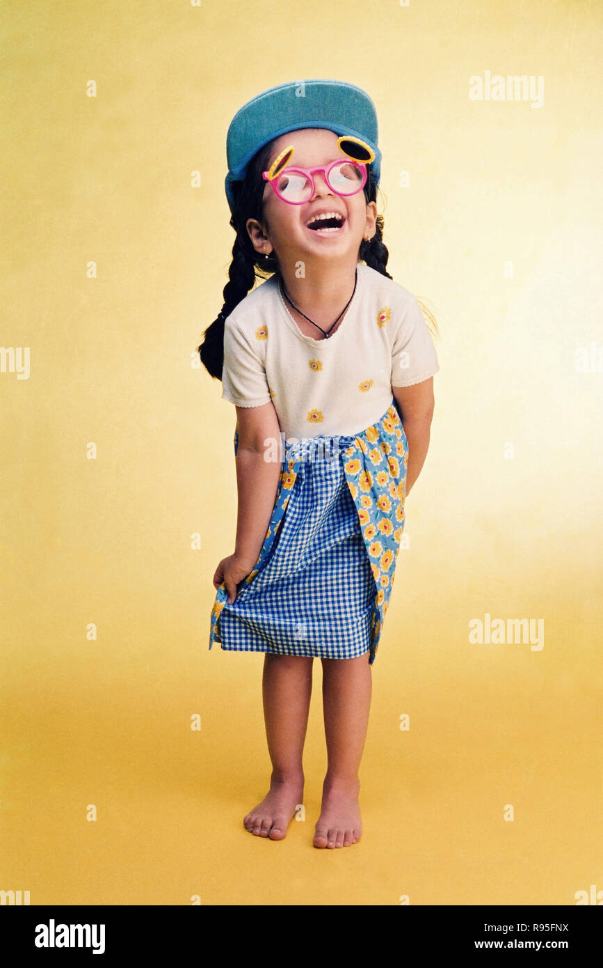 Girl child wearing funny glasses and cap Stock Photo Alamy