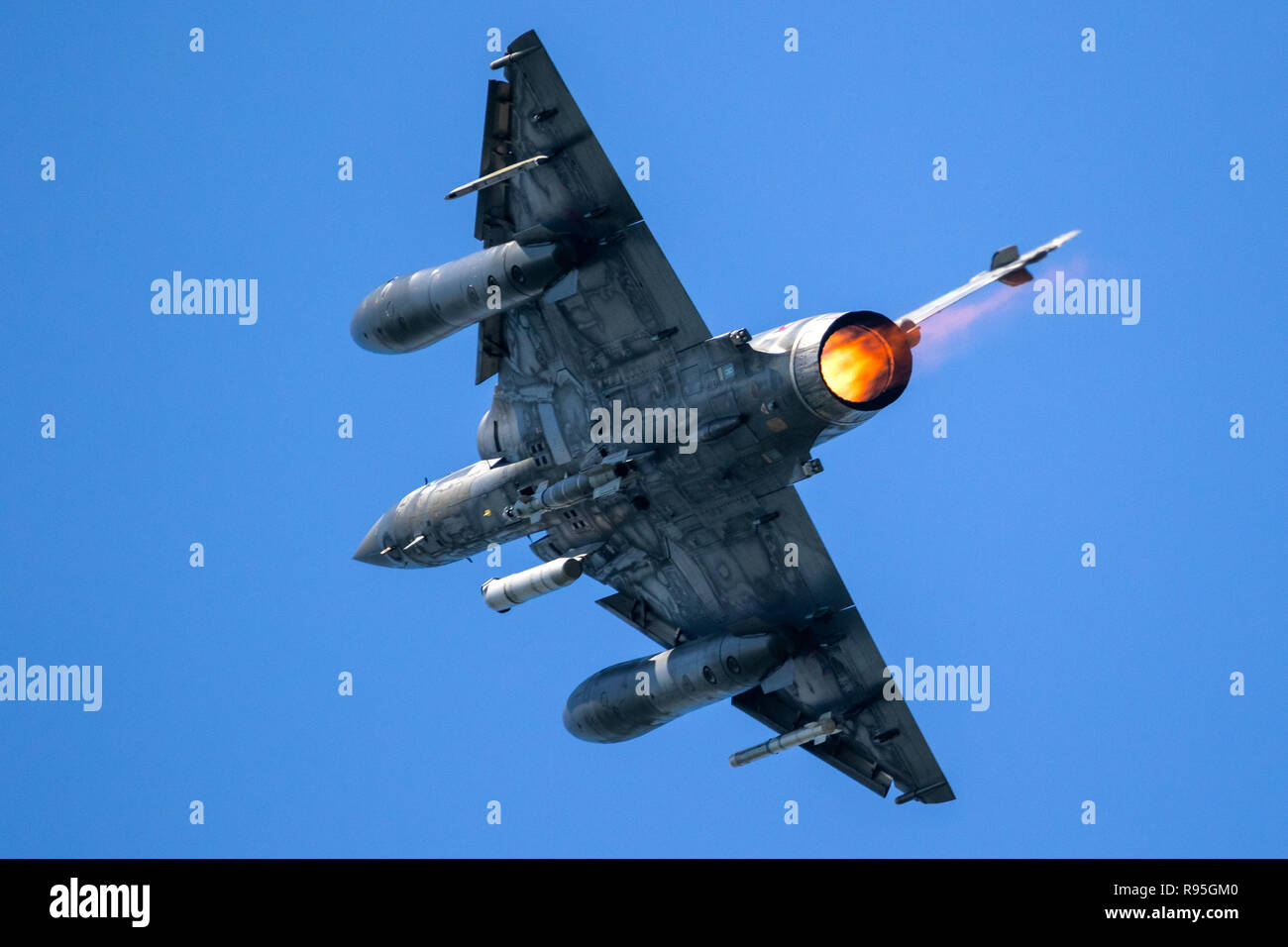 Armed fighter jet plane in flight Stock Photo - Alamy