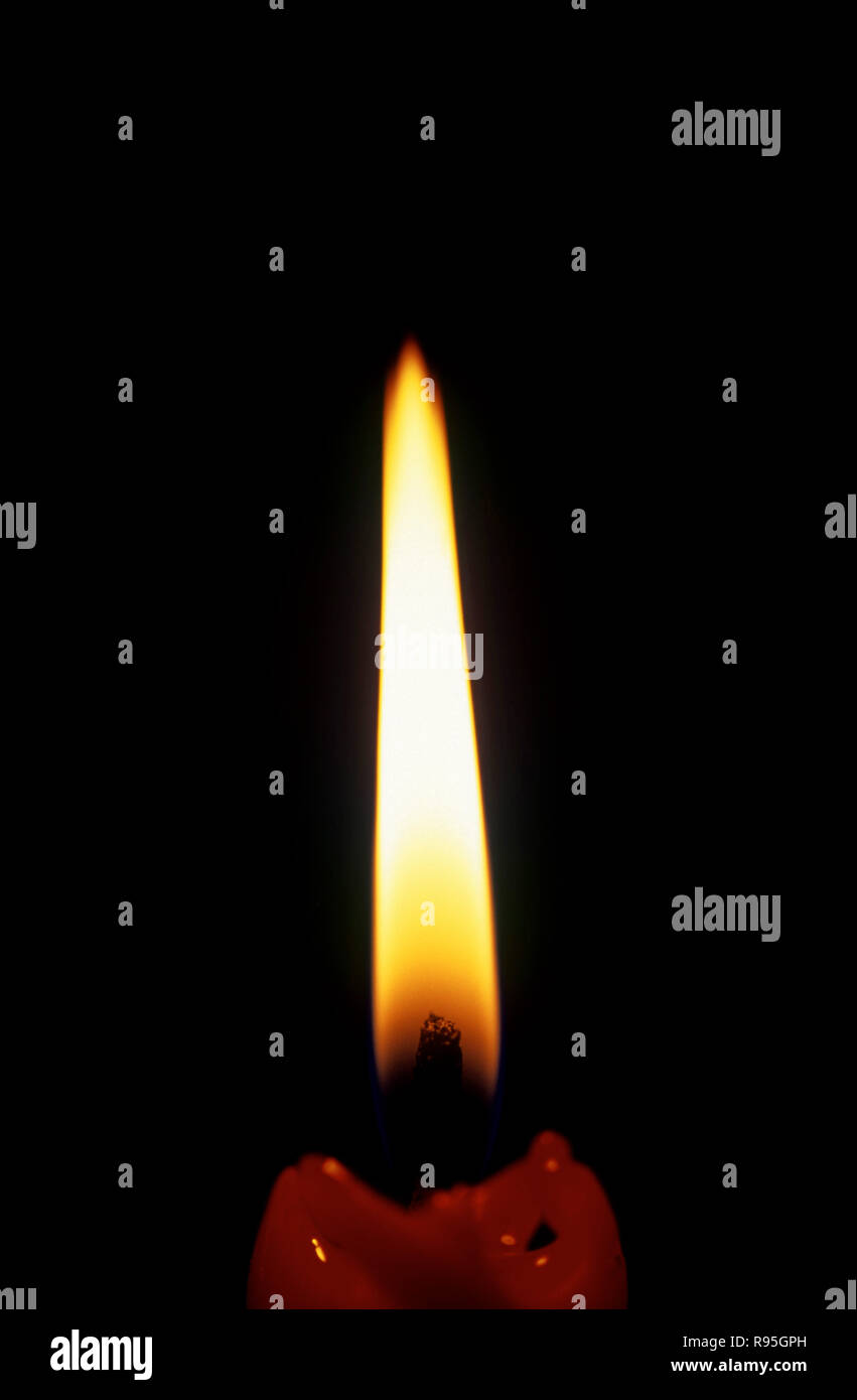 Candle burning on black background Stock Photo Alamy