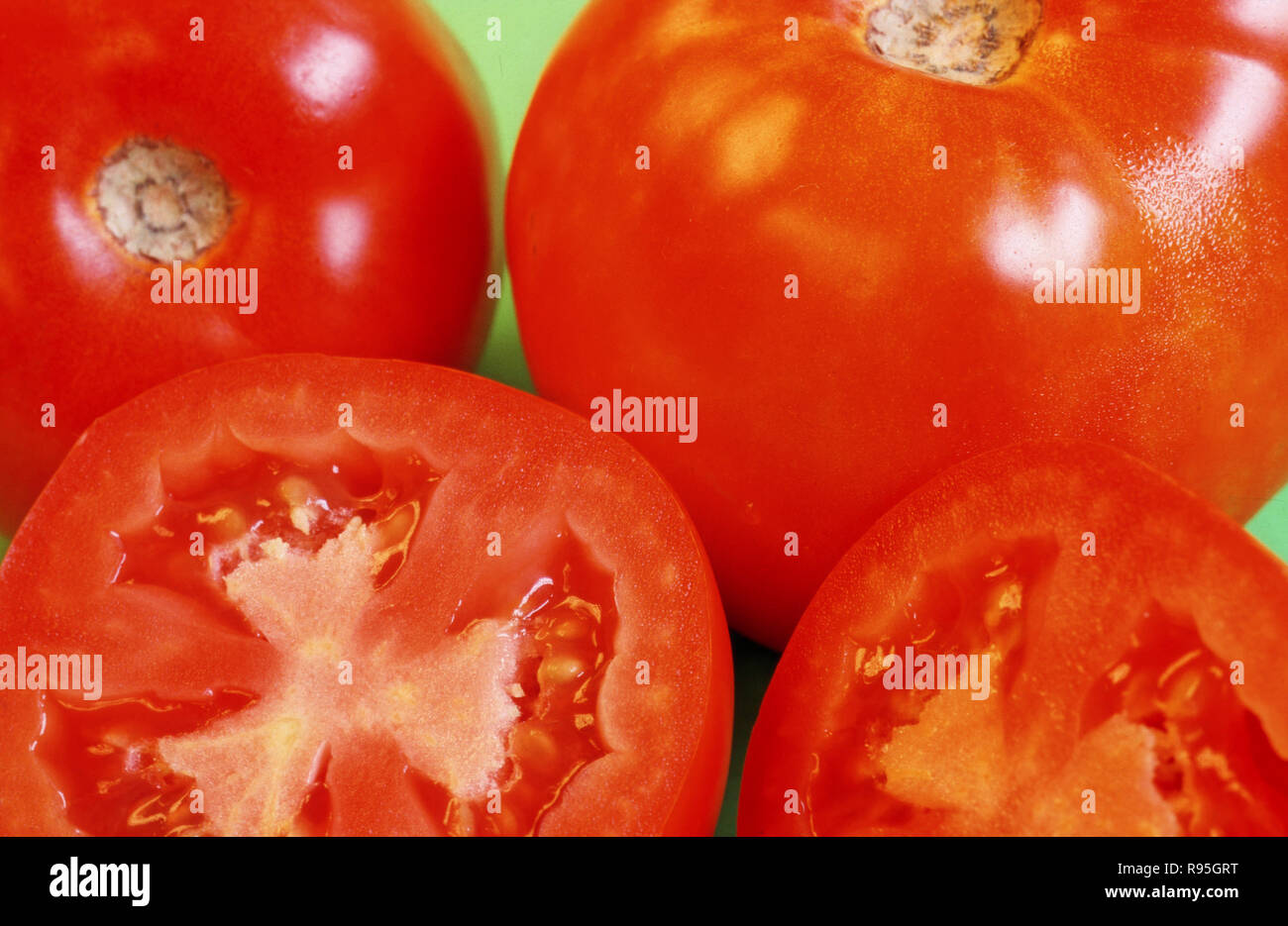 Tomatoes sliced and full Stock Photo