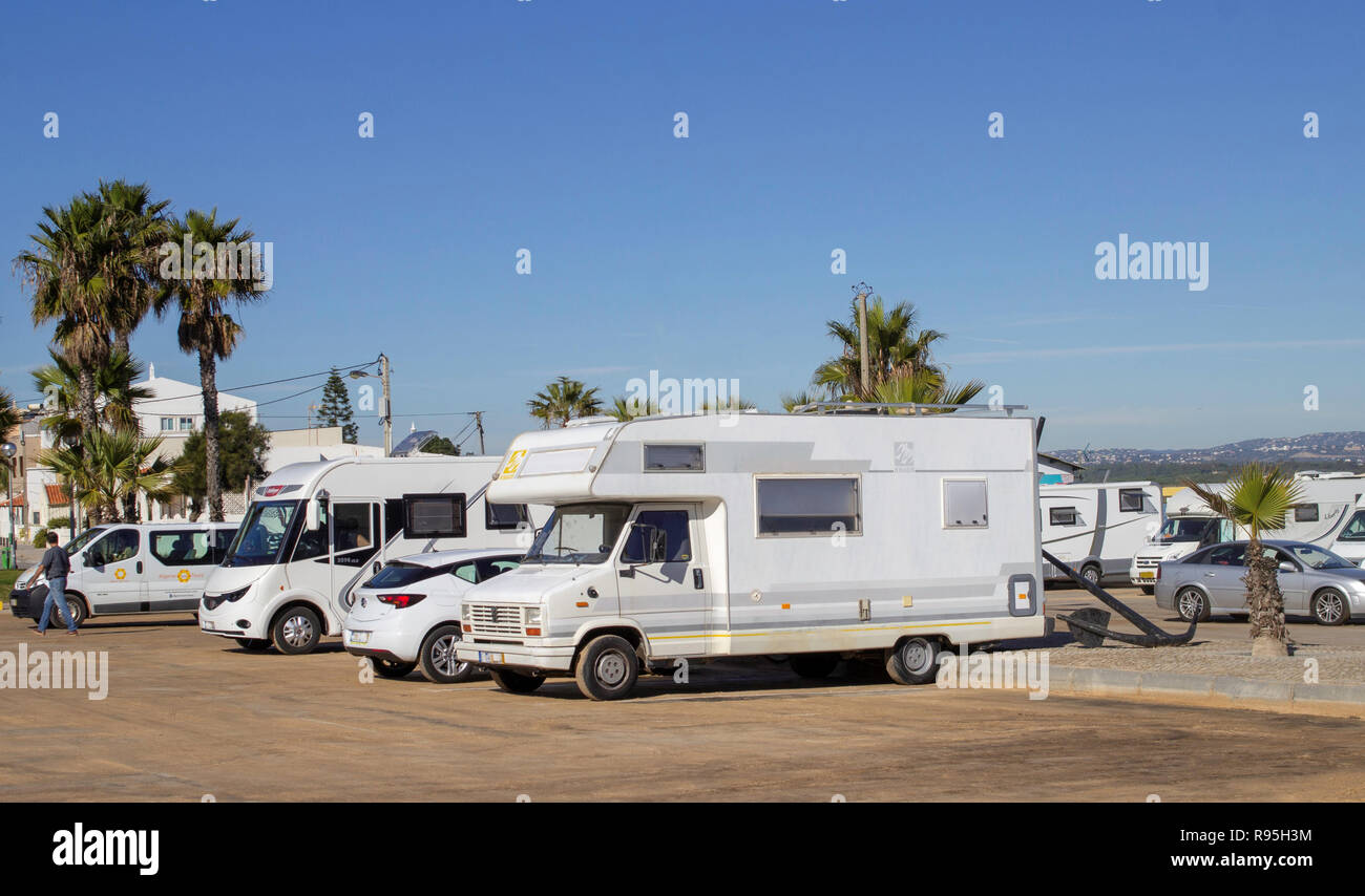Faro, Portugal.Camper vans parked up on the beach of Faro Island, Faro, Portugal. Stock Photo