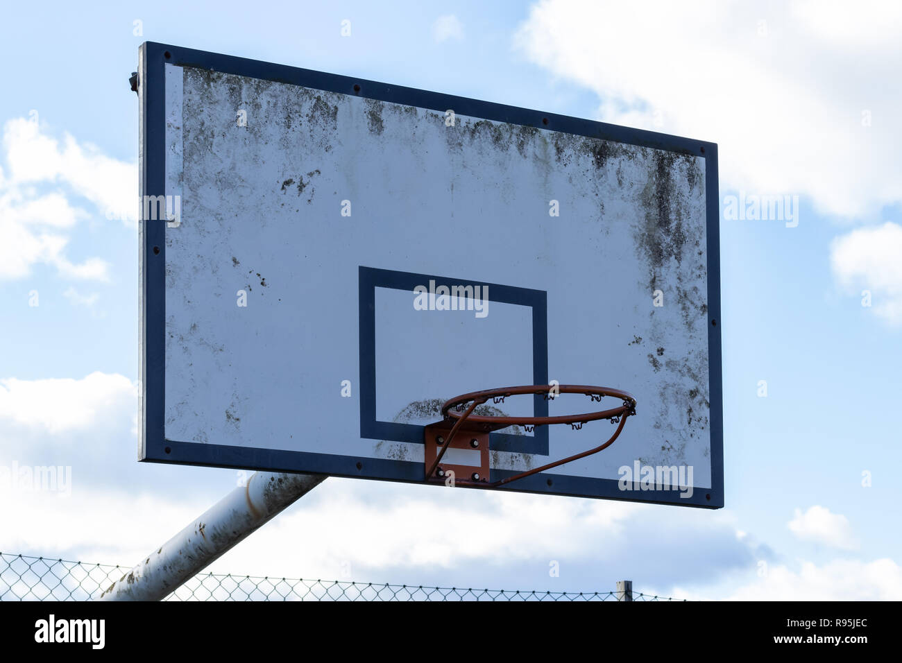 Old street basketball ring against the sky Stock Photo