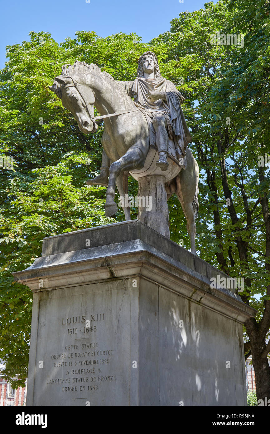 Equestrian statue of Louis XIII by Jean-Pierre Cortot (1787-1843) in a sunny summer day in Paris, France Stock Photo