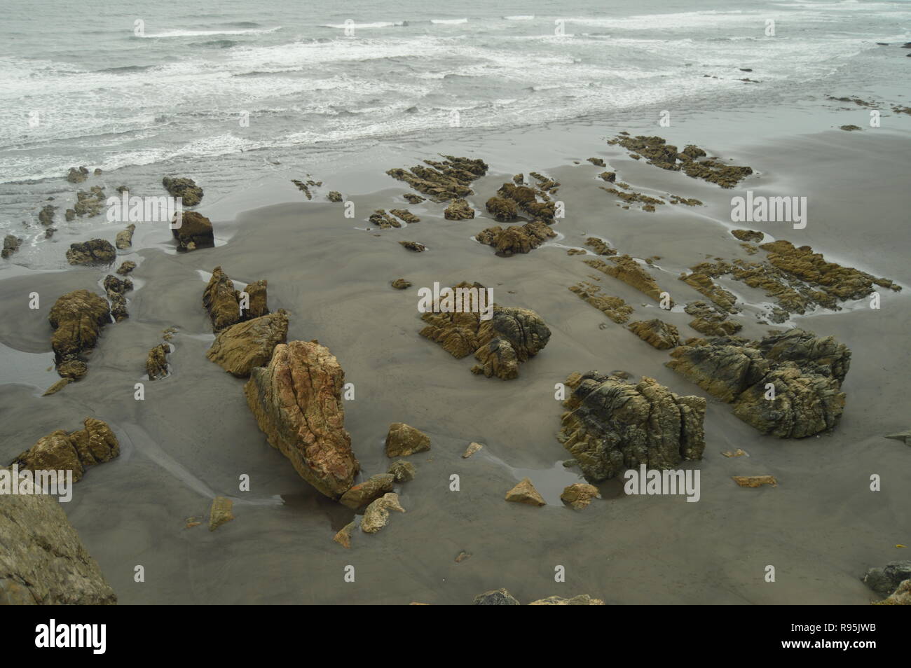 Remains Of Flysch Geological Formations On Los Quebrantos Beach On