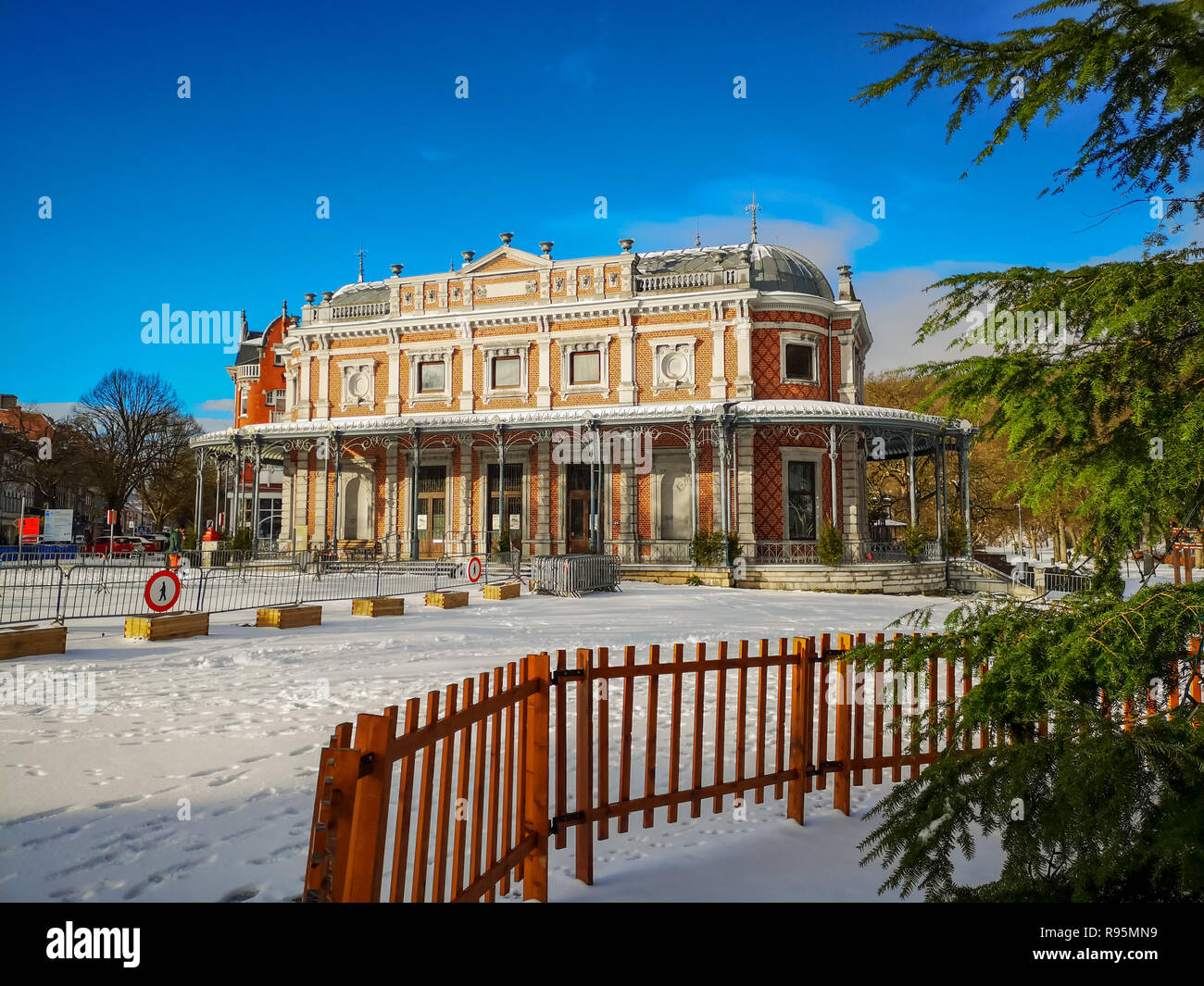 Historical pavilion Des Petits Jeux in the city center of Spa, Belgium, part of the Gallery Leopold II and the parc de Sept Heures, covered in snow. Stock Photo