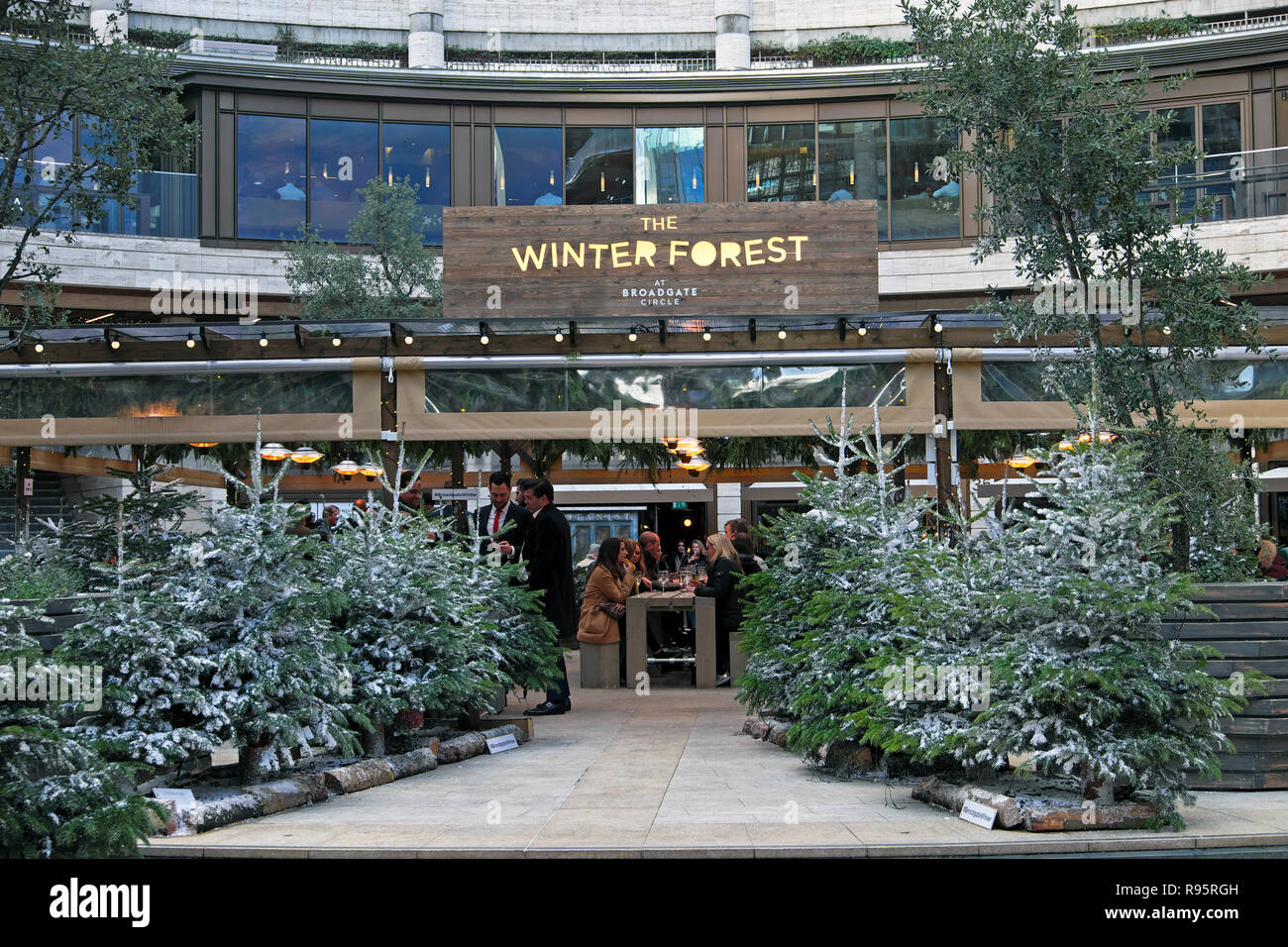 The Winter Forest bar and grill restaurant exterior with Christmas trees at Broadgate Circle in The City of London England UK  KATHY DEWITT Stock Photo