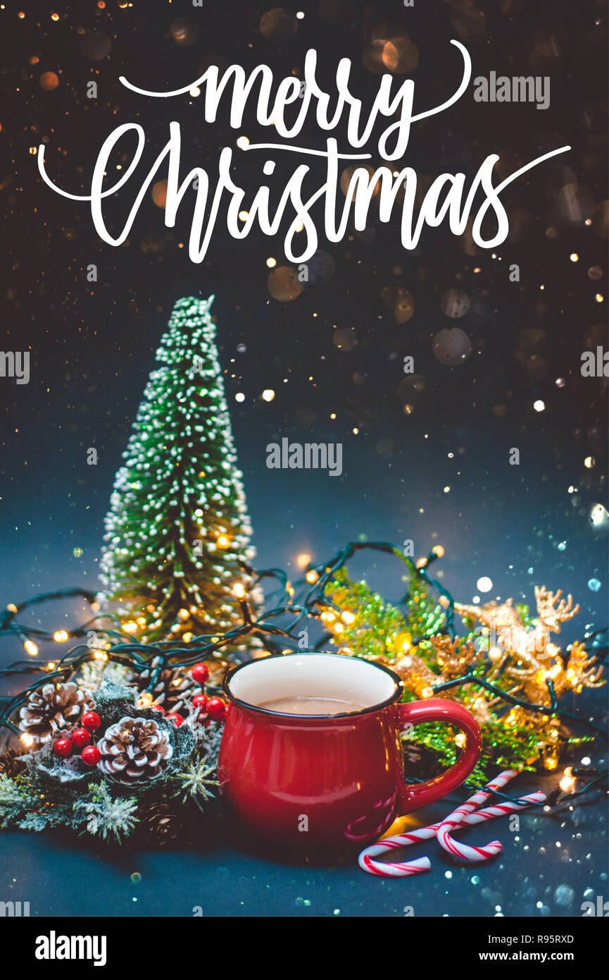 Fresh and hot coffee in a red cup with Christmas lights and decorations on  a black and blue background with golden sparkles and quote Merry Christmas  Stock Photo - Alamy, image size:865x1390