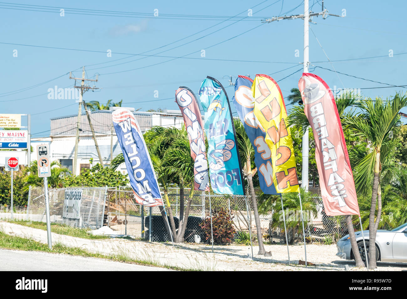 Marathon Usa May 1 Grill Bar Seafood Local Restaurant Signs Colorful Banners Flags Parking Lot On Overseas Highway Road Us1 In Marathon Usa May 1 Grill Bar Seafood Local Restaurant Signs Colorful Banners Flags Parking Lot On Overseas Highway Road Us1 In