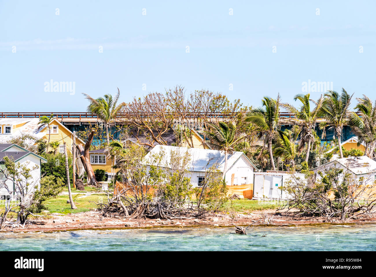 Many damaged, destroyed houses on beach by shore, coast in Florida keys, bridge after, aftermath of destruction of hurricane irma, houses after storm  Stock Photo