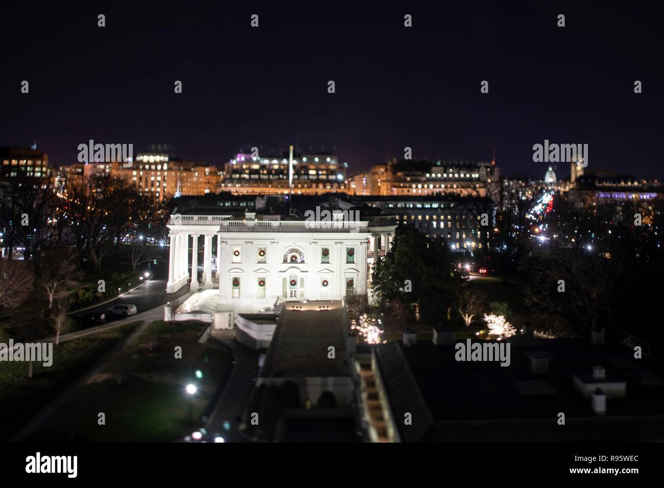 The west facade of the White House decorated for Christmas and lighted at night December 12, 2018 in Washington, DC. Stock Photo