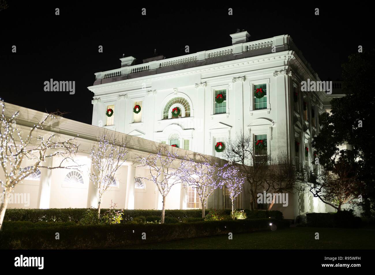 The White House decorated for Christmas and lighted at night December 12, 2018 in Washington, DC. Stock Photo