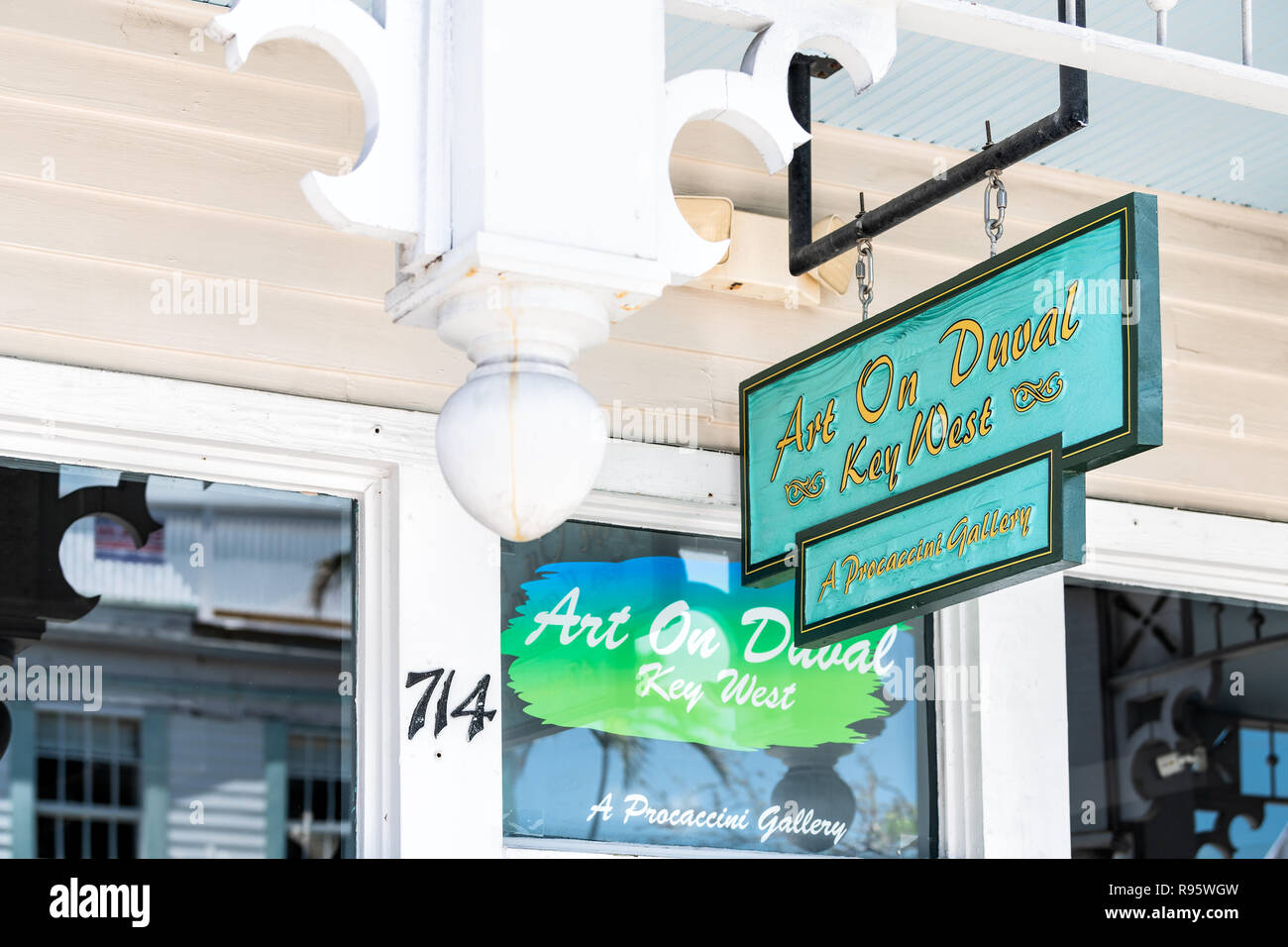 Key West, USA - May 1, 2018: Art on Duval street, Procaccini gallery, studio hanging sign selling painting, fine work Stock Photo