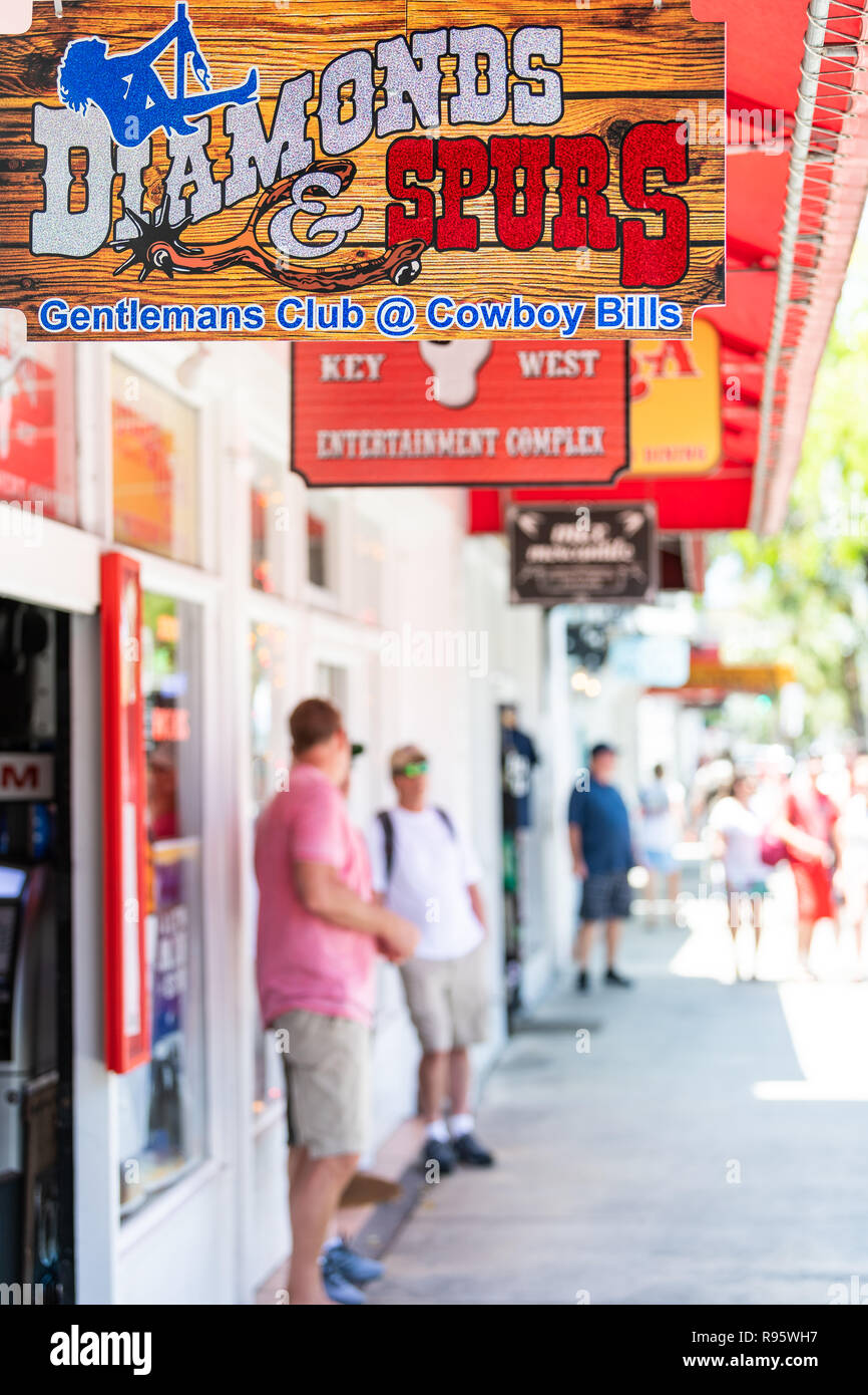 Key West, USA - May 1, 2018: Diamonds and Spurs gentlemans club, cowboy bills bar, restaurant, venue sign for stripping, entertainment on Duval street Stock Photo