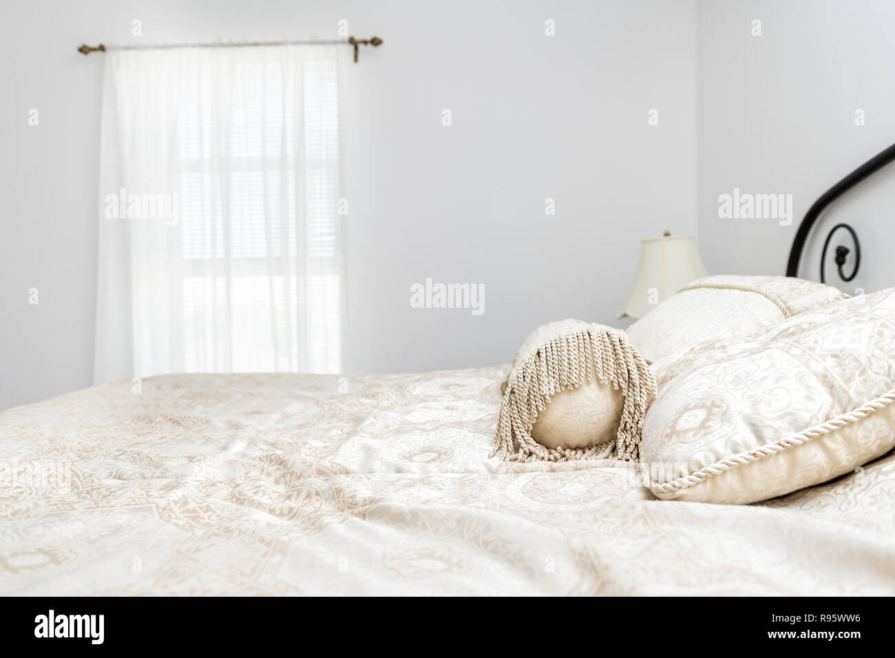 Closeup Of New Bed Comforter With Decorative Pillows In Bedroom In Staging  Model Home Apartment Or House Stock Photo - Download Image Now - iStock