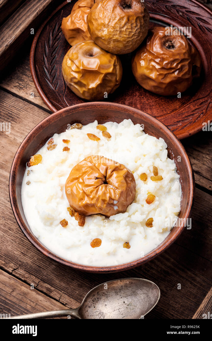 Traditional rice porridge on milk with apples Stock Photo