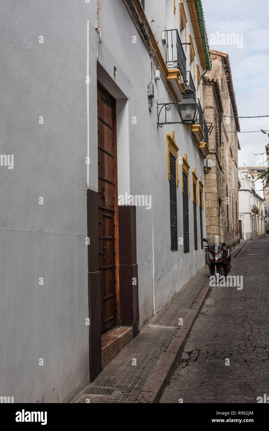 Exterior of a local building in Spain. The building seems to be a mix of old and modern architecture. The Streets seem to be narrow. It seems to be a  Stock Photo
