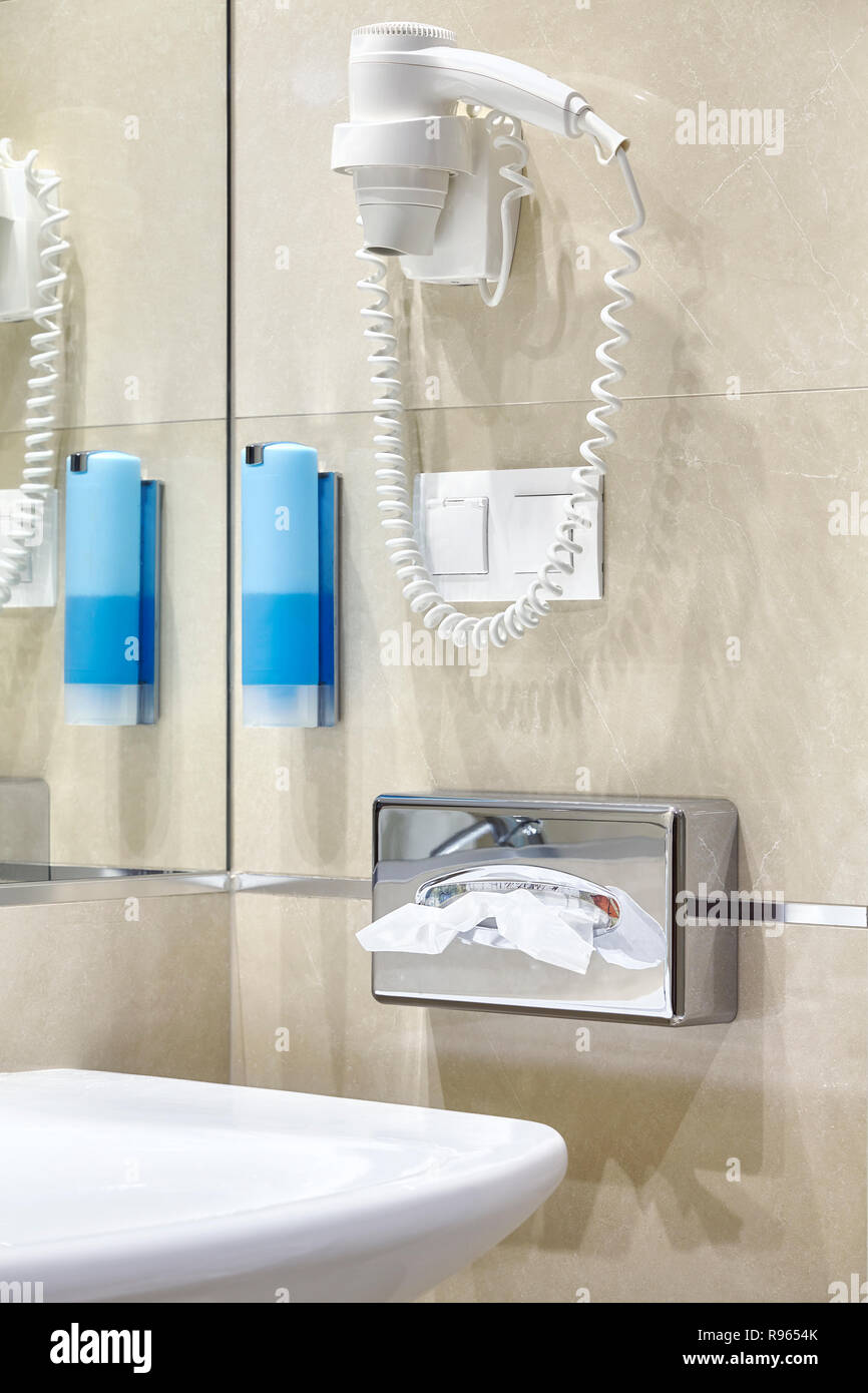 Hair dryer in a hotel bathroom. Stock Photo