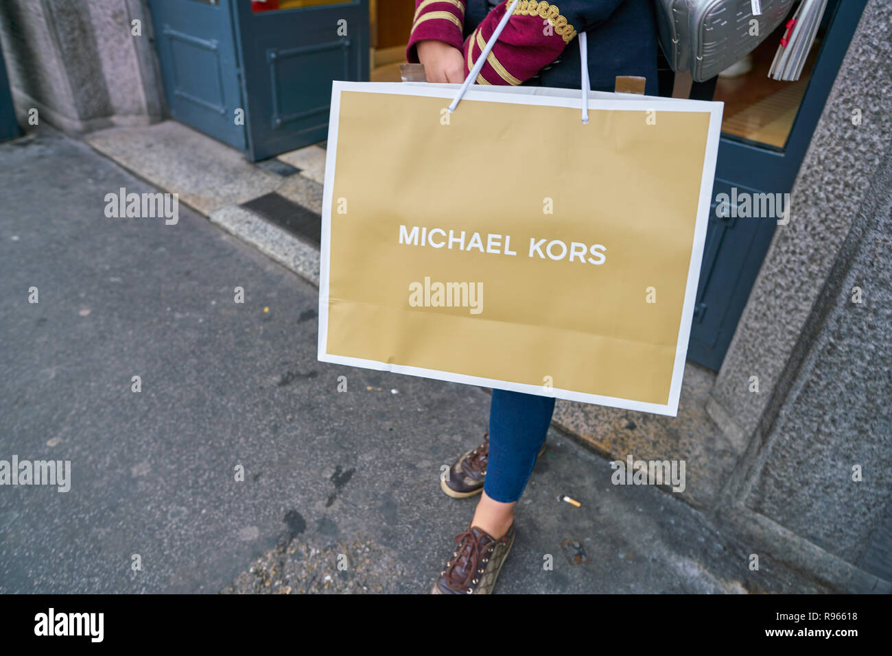 MILAN, ITALY - CIRCA NOVEMBER, 2017: a woman stand with a Michael Kors  branded shopping bag in Milan Stock Photo: 229403140 - Alamy