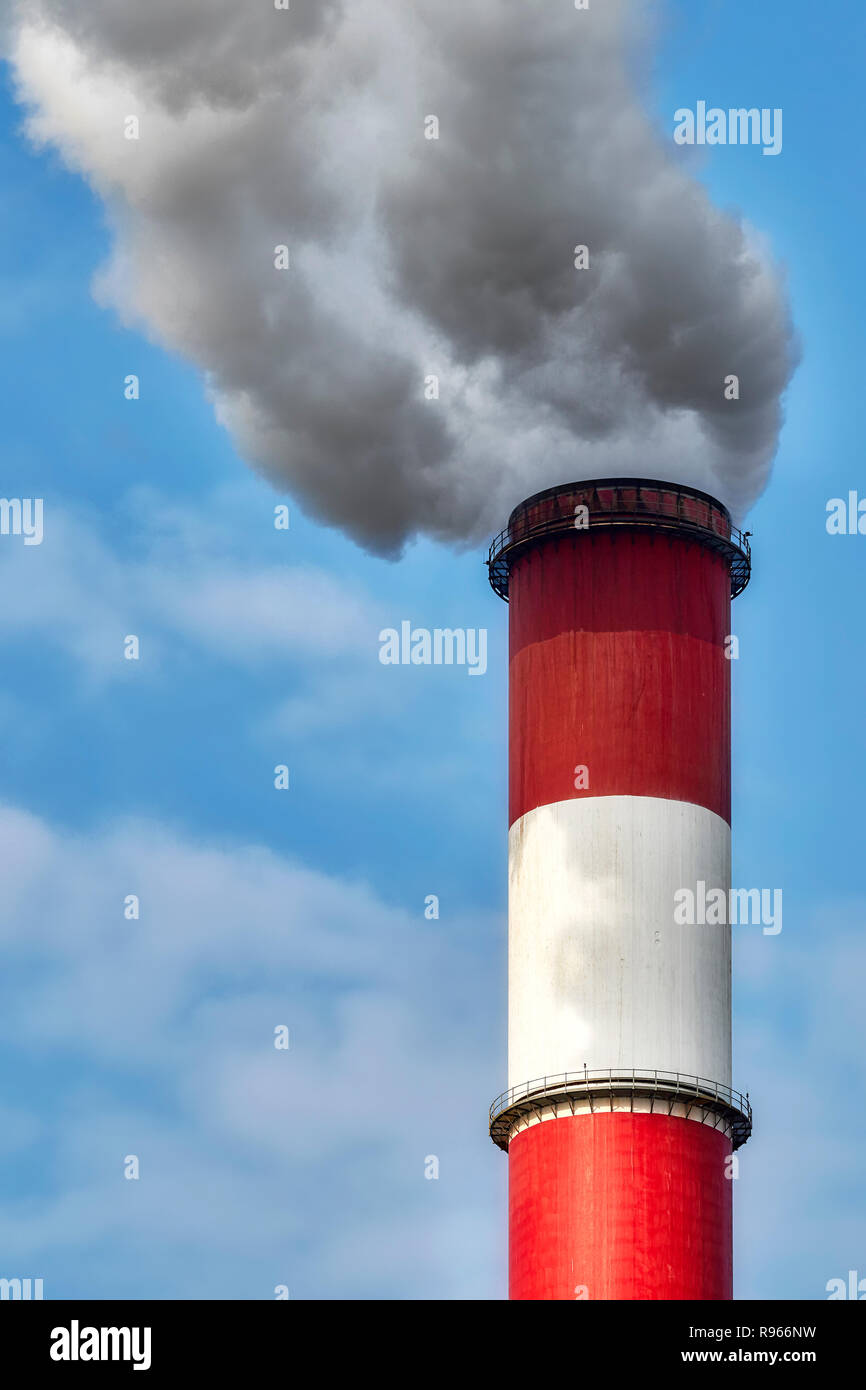 Smokey industrial chimney, environmental pollution concept. Stock Photo