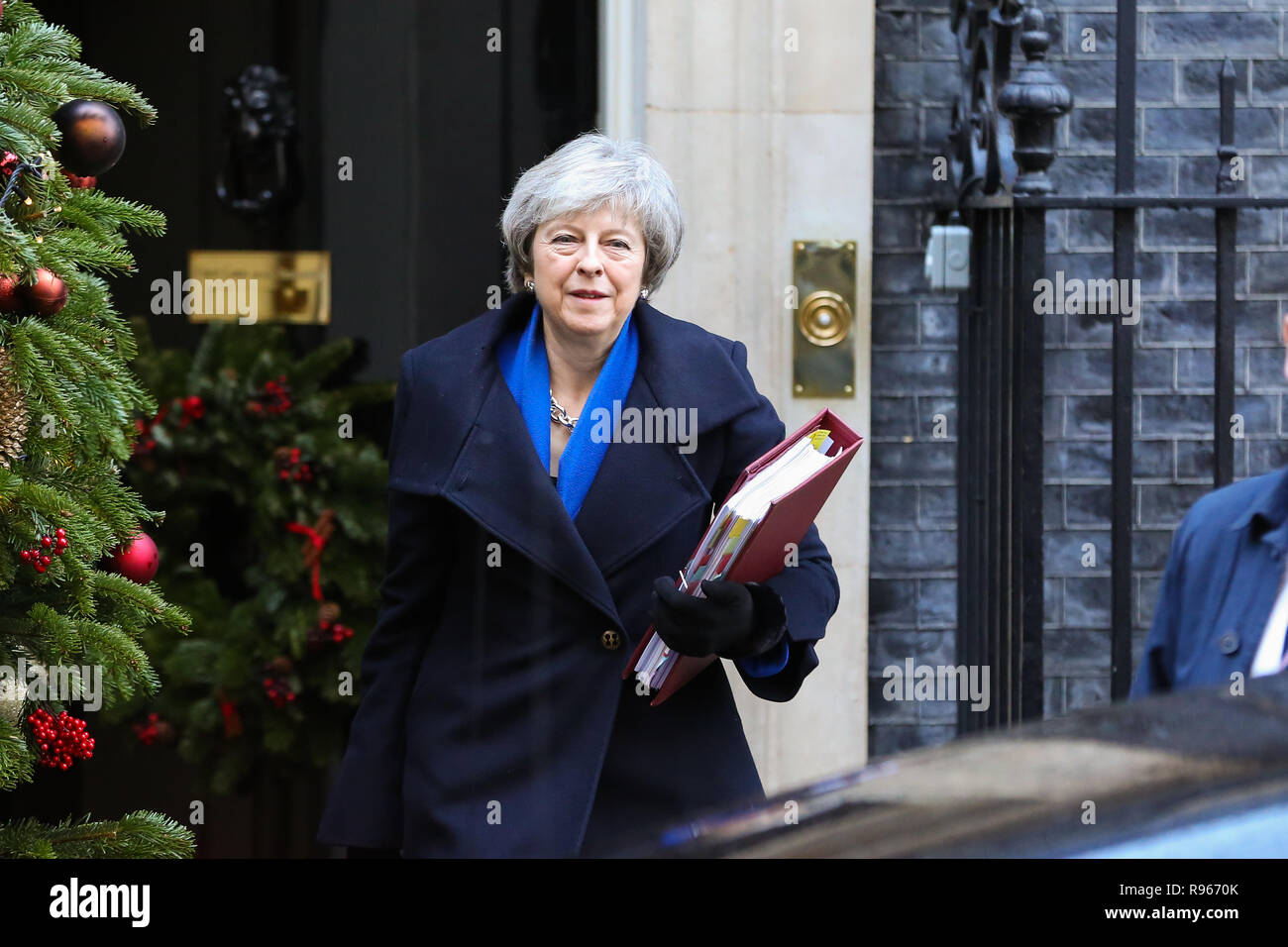 British Prime Minister Theresa May departs from Number 10 Downing Street to attend the final Prime Minister's Questions (PMQs)  of 2018 in the House of Commons with 100 day for Brexit. The United Kingdom will formally leave the European Union by 29 March 2019 and the UK Government has set aside £2 billion for a 'No Deal' Brexit. Stock Photo