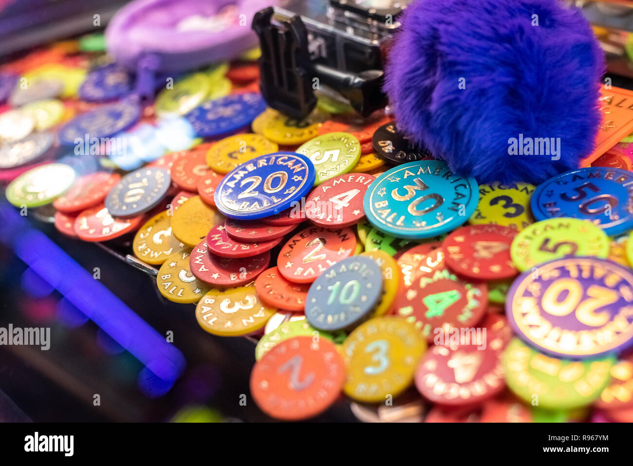 Colorful poker chips in casino machine to win prizes Stock Photo Alamy