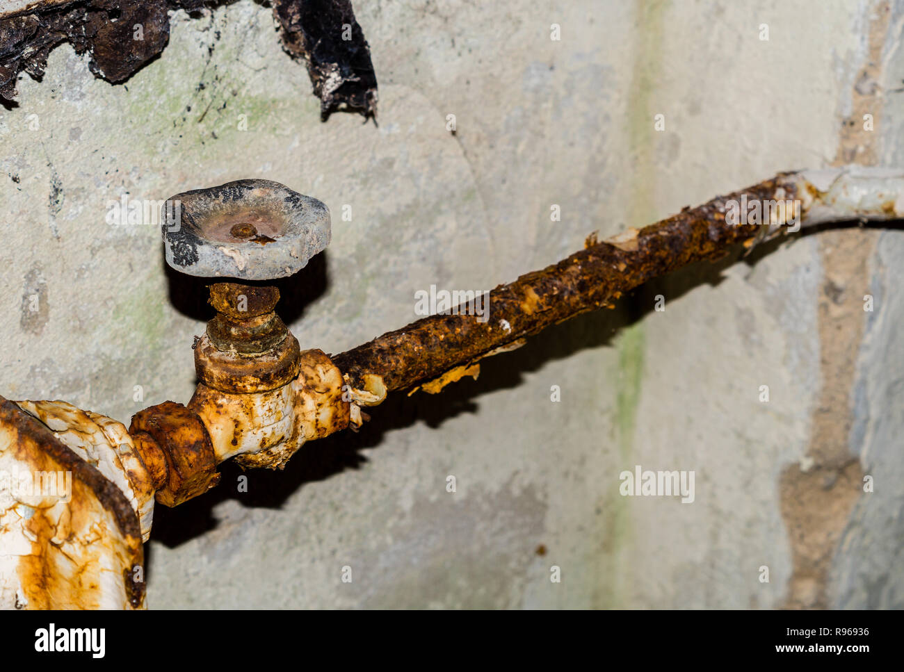 Old rusty heating valve Stock Photo
