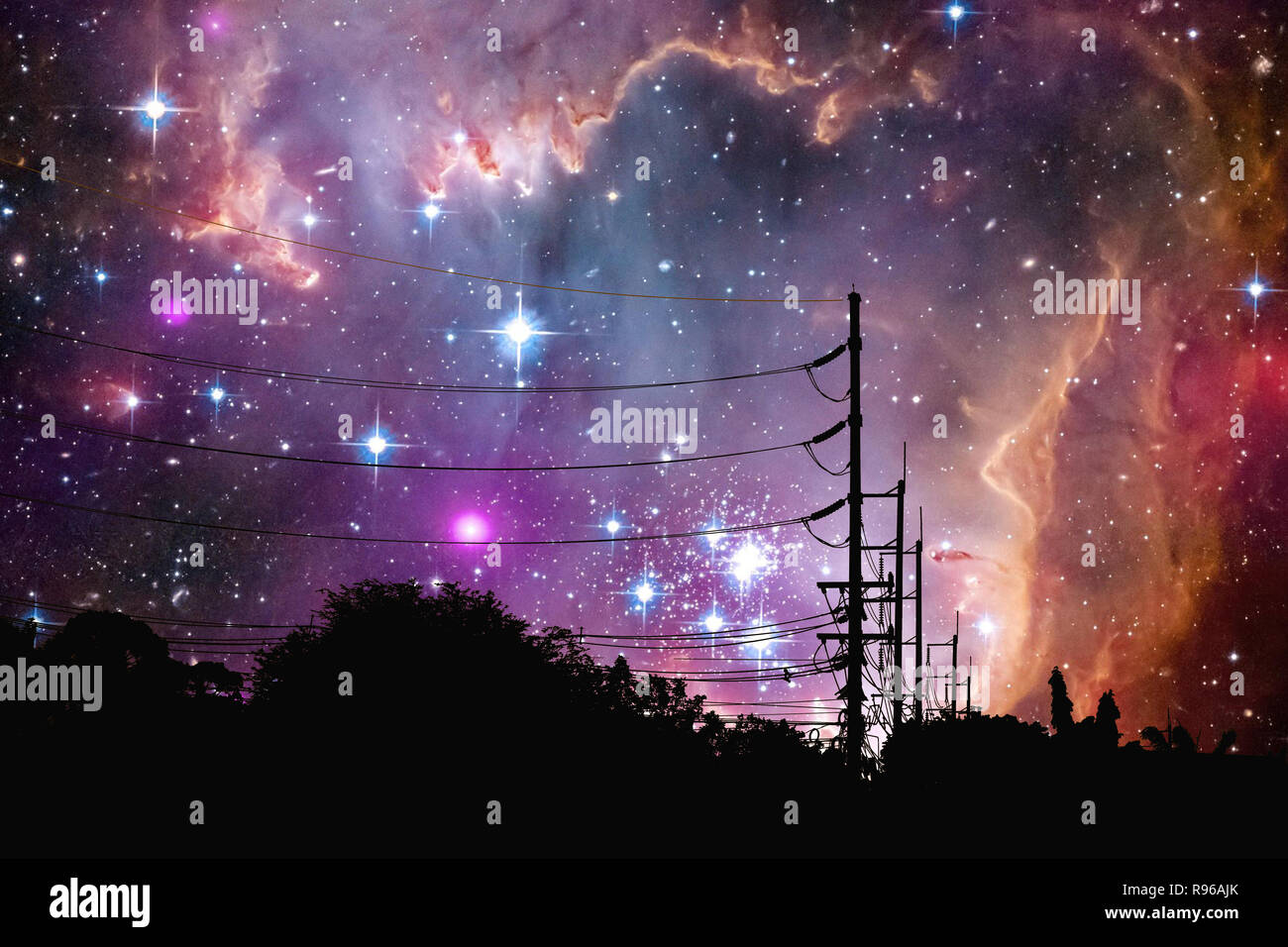 Galaxy floats in night sky above the shadow of an electric pole, Elements of this image furnished by NASA Stock Photo