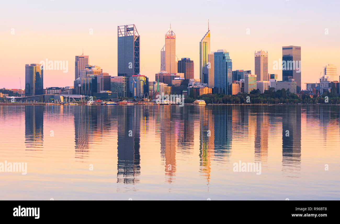 The Perth city skyline reflecting in the Swan river at sunrise. Perth, Western Australia Stock Photo