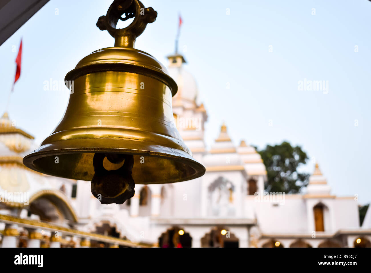 Ring bells in temple. Golden metal bell isolated. Big brass Buddhist bell of Japanese temple. Ringing bell in temple is belief auspicious. Bangkok, Th Stock Photo
