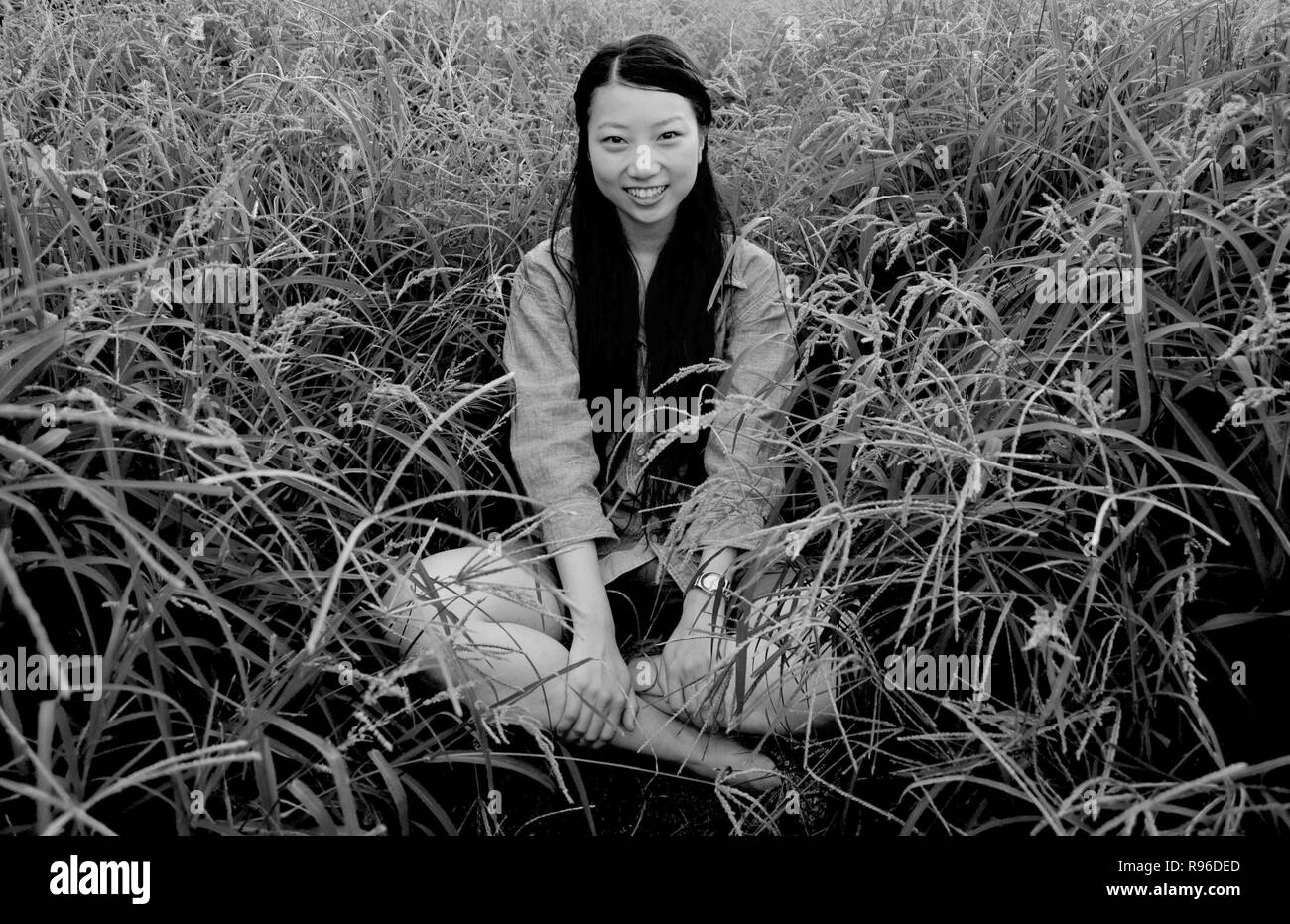 Asian female model poses for pictures in the nature Stock Photo
