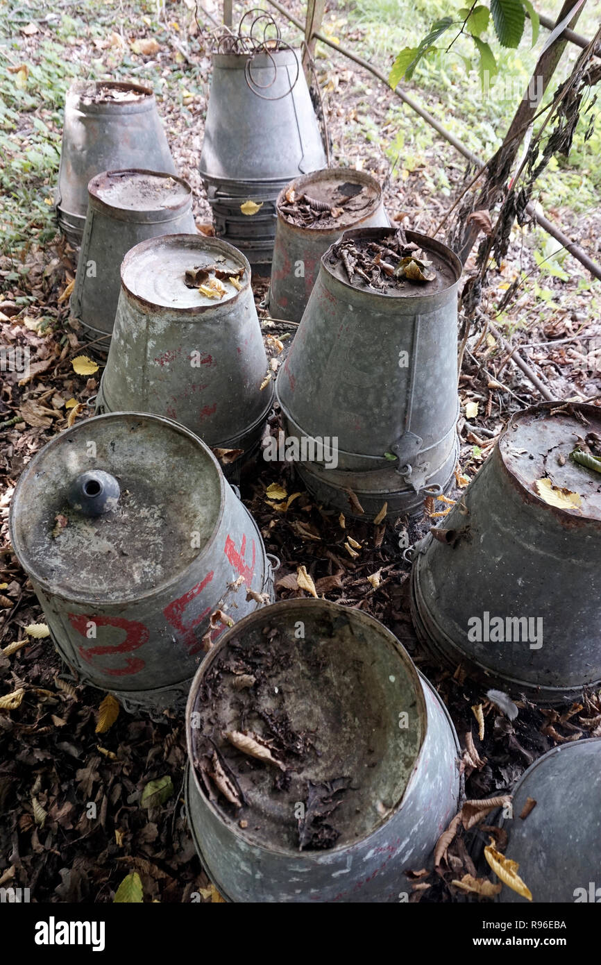 piles of redundant galvanised buckets Stock Photo