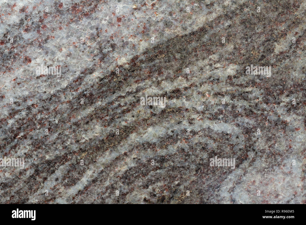 Granite texture macro. White, black, red. Stock Photo