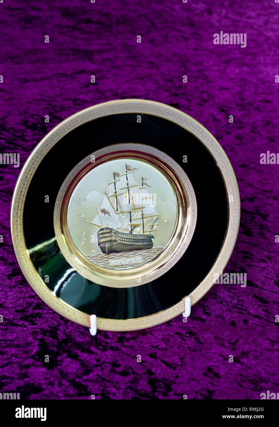 Chokin Decorative Plates Decorated with 24 Karat Gold Leaf depicting The HMS Victory Warship Stock Photo