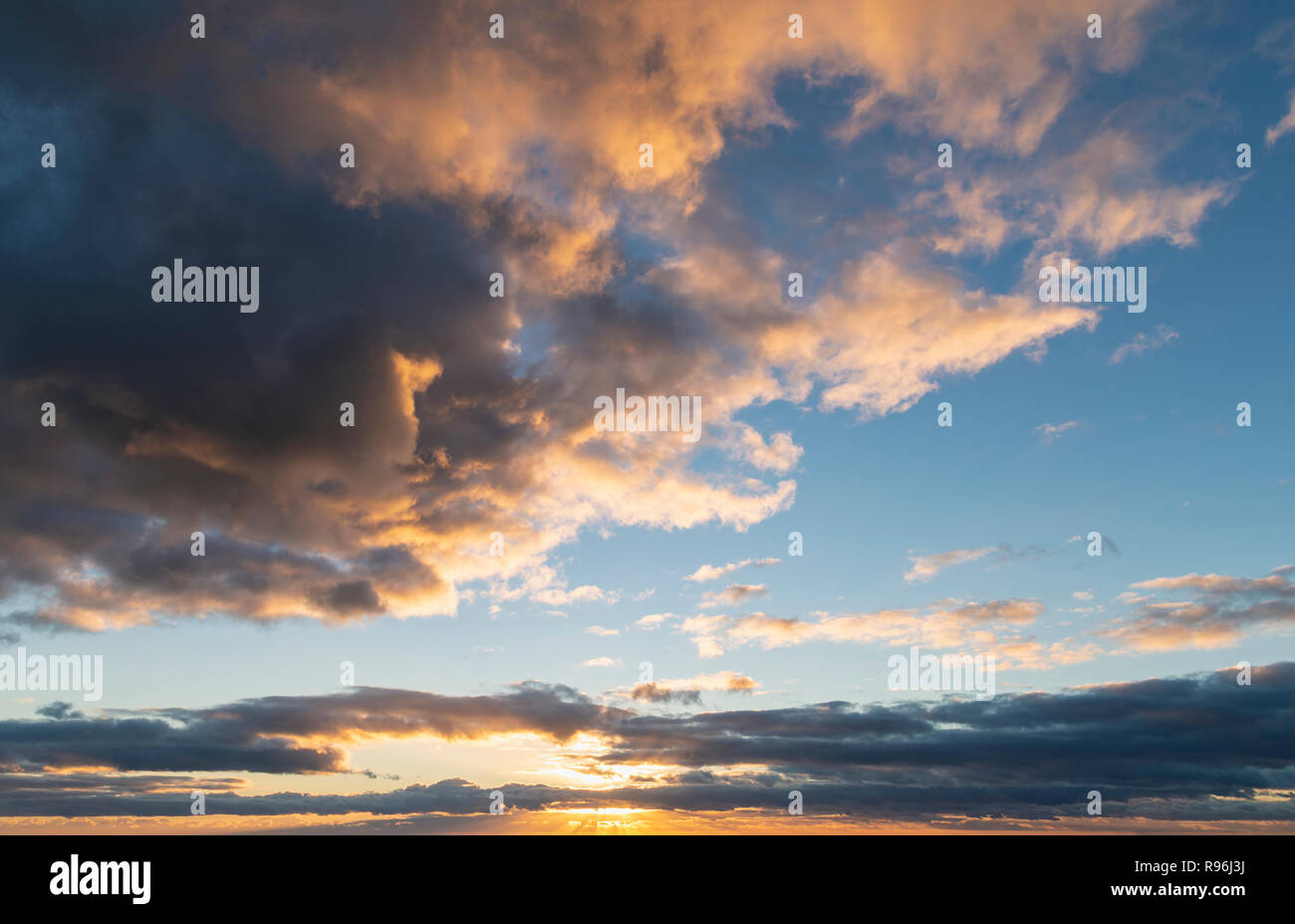 Beautiful colorful golden hour sunset sky with cloud formation and ...