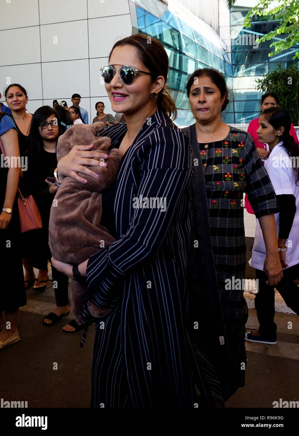 Mumbai, India. 20th Dec, 2018. Indian Tennis player Sania Mirza, who recently welcomed her baby boy Izhaan Mirza Malik with husband Pakistani cricketer Shoaib Malik, seen arriving at the Mumbai airport with her toddler. Credit: Azhar Khan/SOPA Images/ZUMA Wire/Alamy Live News Stock Photo