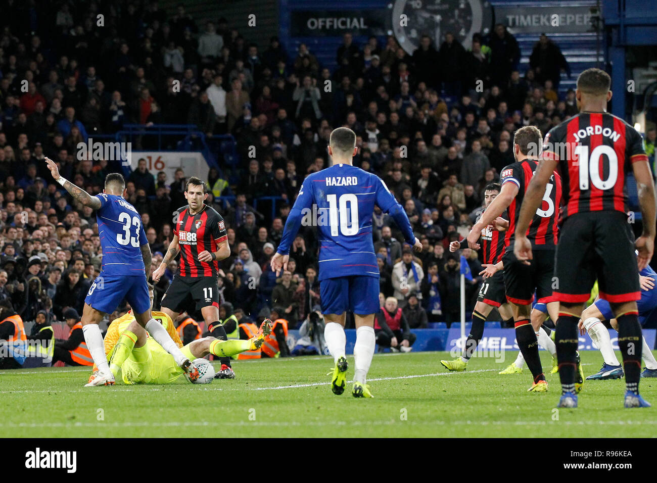 London, UK. 19th Dec, 2018. Artur Boruc of AFC Bournemouth saves at the feet of Emerson Palmieri of Chelsea during the EFL Carabao Cup Quarter Final match between Chelsea and Bournemouth at Stamford Bridge, London, England on 19 December 2018. Photo by Carlton Myrie.  Editorial use only, license required for commercial use. No use in betting, games or a single club/league/player publications. Credit: UK Sports Pics Ltd/Alamy Live News Stock Photo