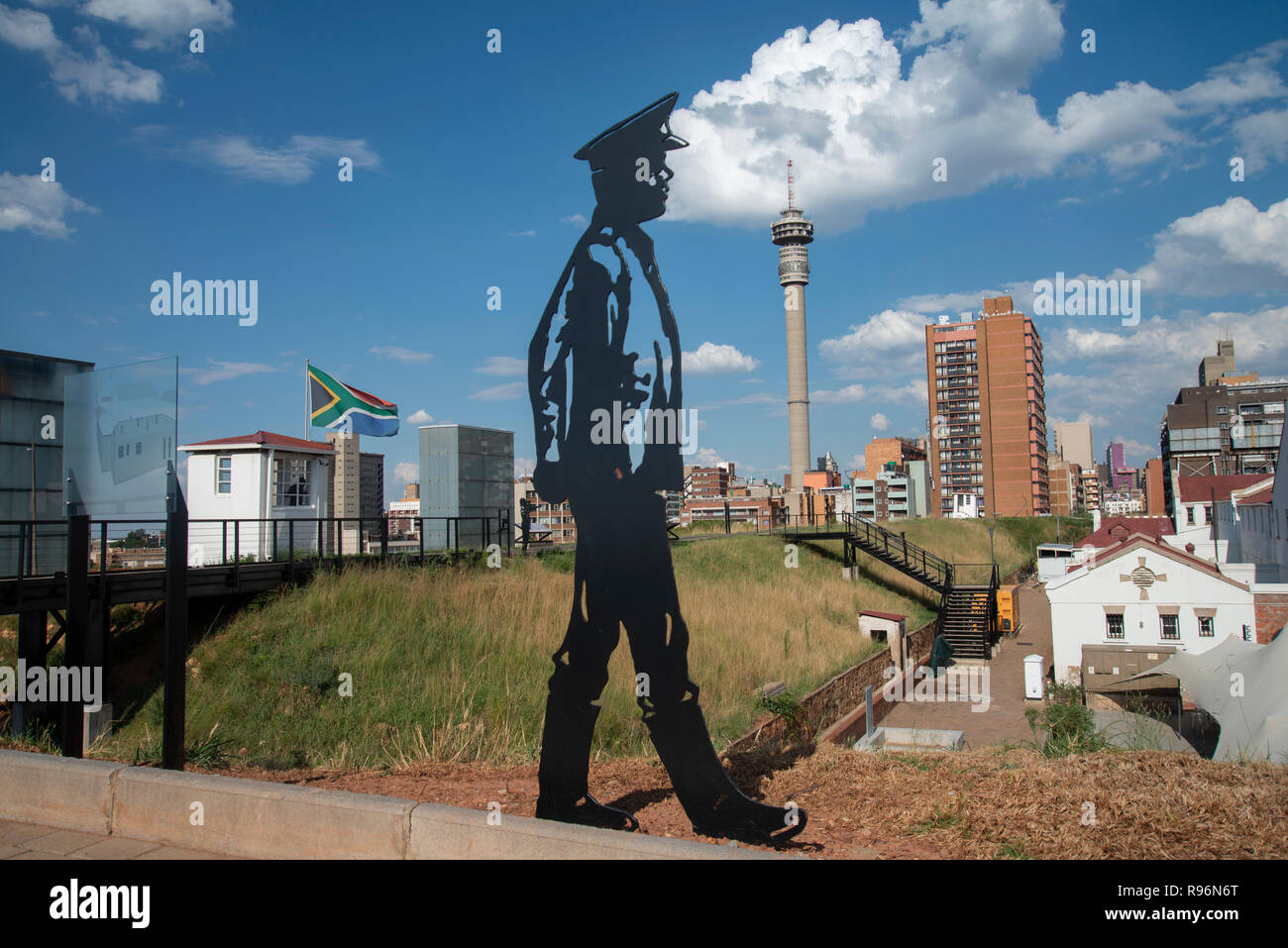 Johannesburg, South Africa, 19 December, 2018. A silhouetted figure keeps guard over the Old Fort on Constitution Hill, as part of a new permanent exhibition there. Using technology such as holograms, the new exhibition additions officially opened in December, telling the stories about prisoners who were housed here, both during the gold rush and later during apartheid. During apartheid, The Old Fort housed white prisoners. Prison guards and soldiers also feature in the exhibition as the Old Fort was a military garrison during the Anglo-Boer War. Credit: Eva-Lotta Jansson Stock Photo