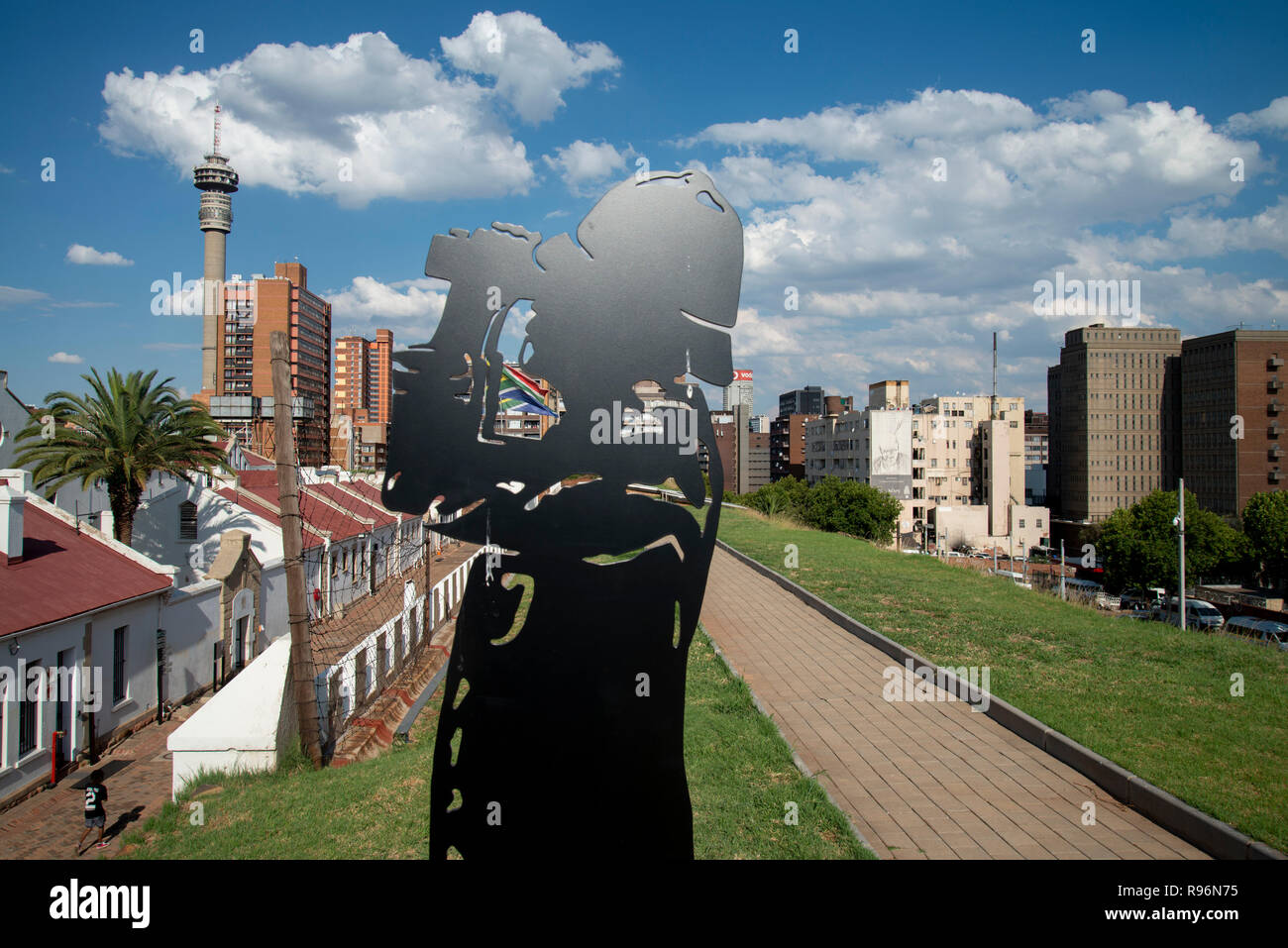 Johannesburg, South Africa, 19 December, 2018. A silhouetted figure keeps guard over the Old Fort on Constitution Hill, as part of a new permanent exhibition there. Using technology such as holograms, the new exhibition additions officially opened in December, telling the stories about prisoners who were housed here, both during the gold rush and later during apartheid. During apartheid, The Old Fort housed white prisoners. Prison guards and soldiers also feature in the exhibition as the Old Fort was a military garrison during the Anglo-Boer War. Credit: Eva-Lotta Jansson Stock Photo