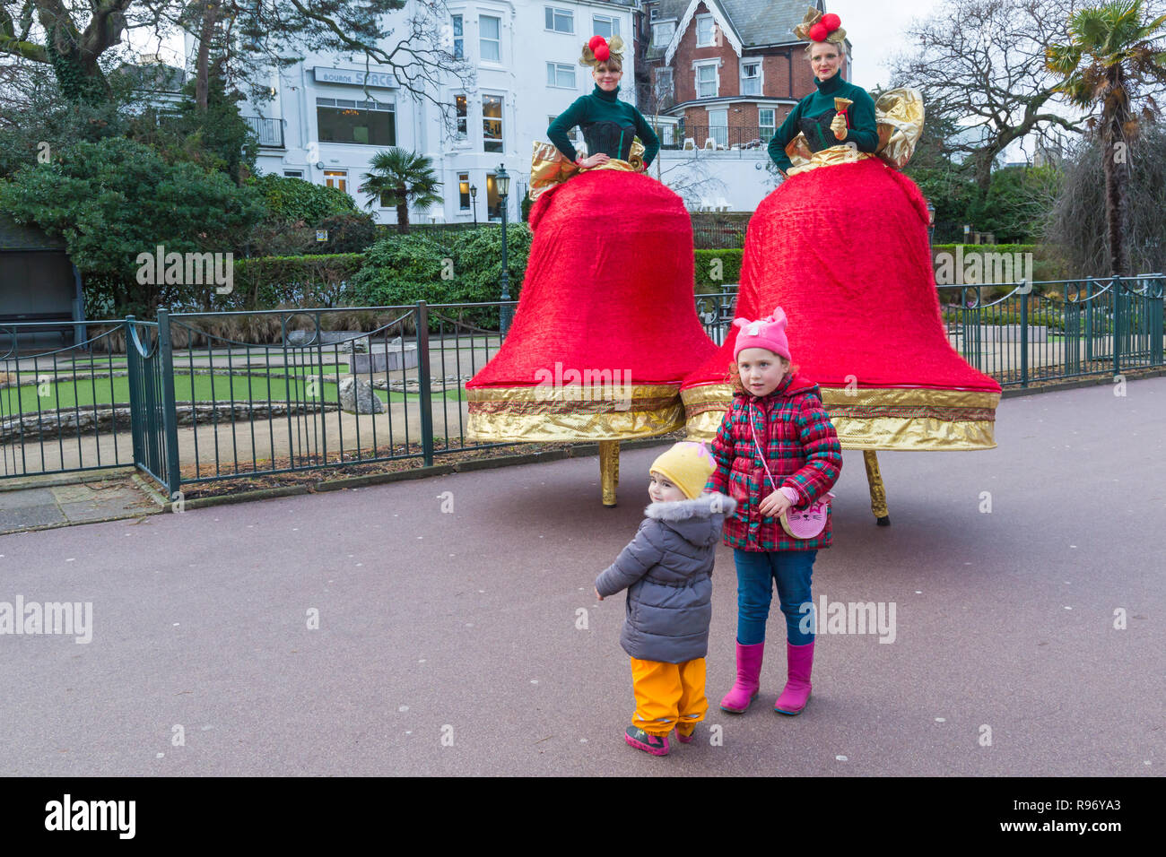 Bournemouth Dorset Uk th December 18 Ding And Dong The Christmas Belles Duo Charming Christmas Bells On Stilts Wander Around Bournemouth Lower Gardens Shimmering Scarlet And Gold Ribbons Ringing Out Yuletide Chimes