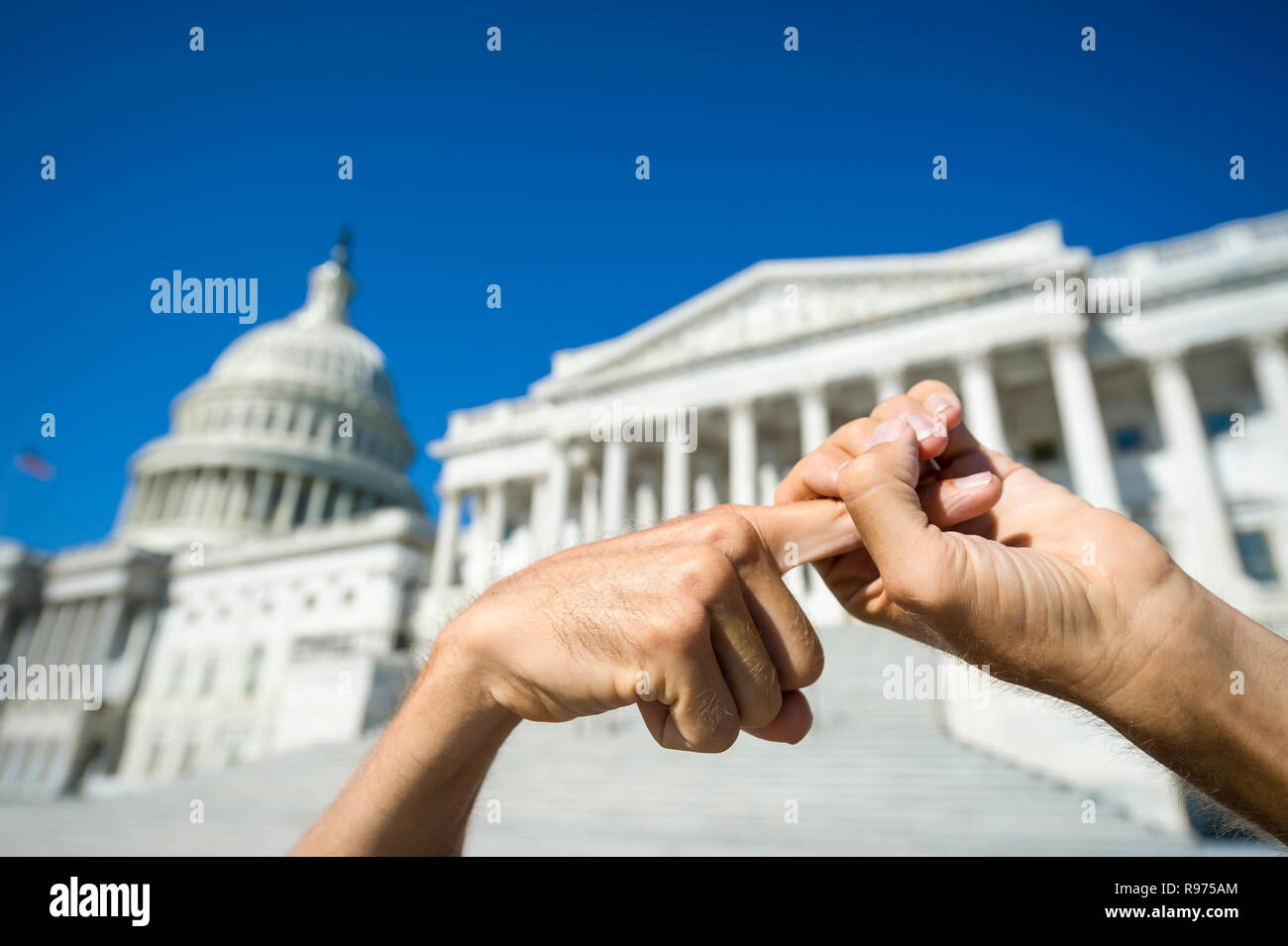 Hands holding of a protestor sending a strong message in front of the Capitol Building in Washington DC, USA Stock Photo