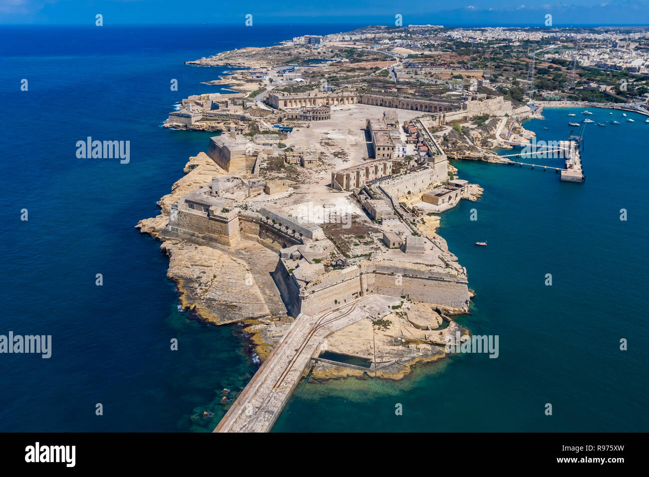 Fort Ricasoli aerial view. Island of Malta from above. Bastioned fort built by the Order of Saint John in Kalkara, Malta. Gallows' Point, north shore of Rinella Bay, entrance to the Grand Harbour Stock Photo