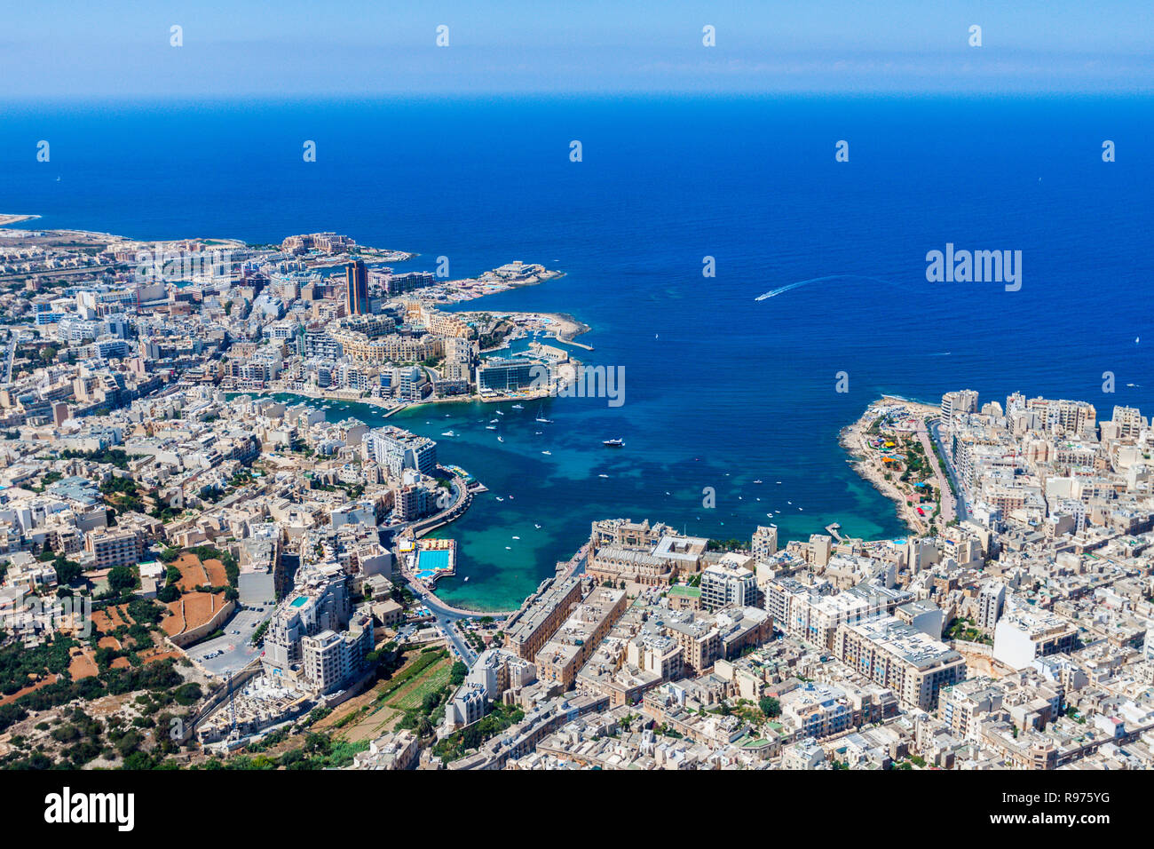 Malta aerial view. St. Julian's (San Giljan) and Tas-Sliema cities. St. Julian’s bay, Balluta bay, Spinola bay, Towns, harbours and coastline of Malta from above. Skyscraper in Paceville district. Stock Photo