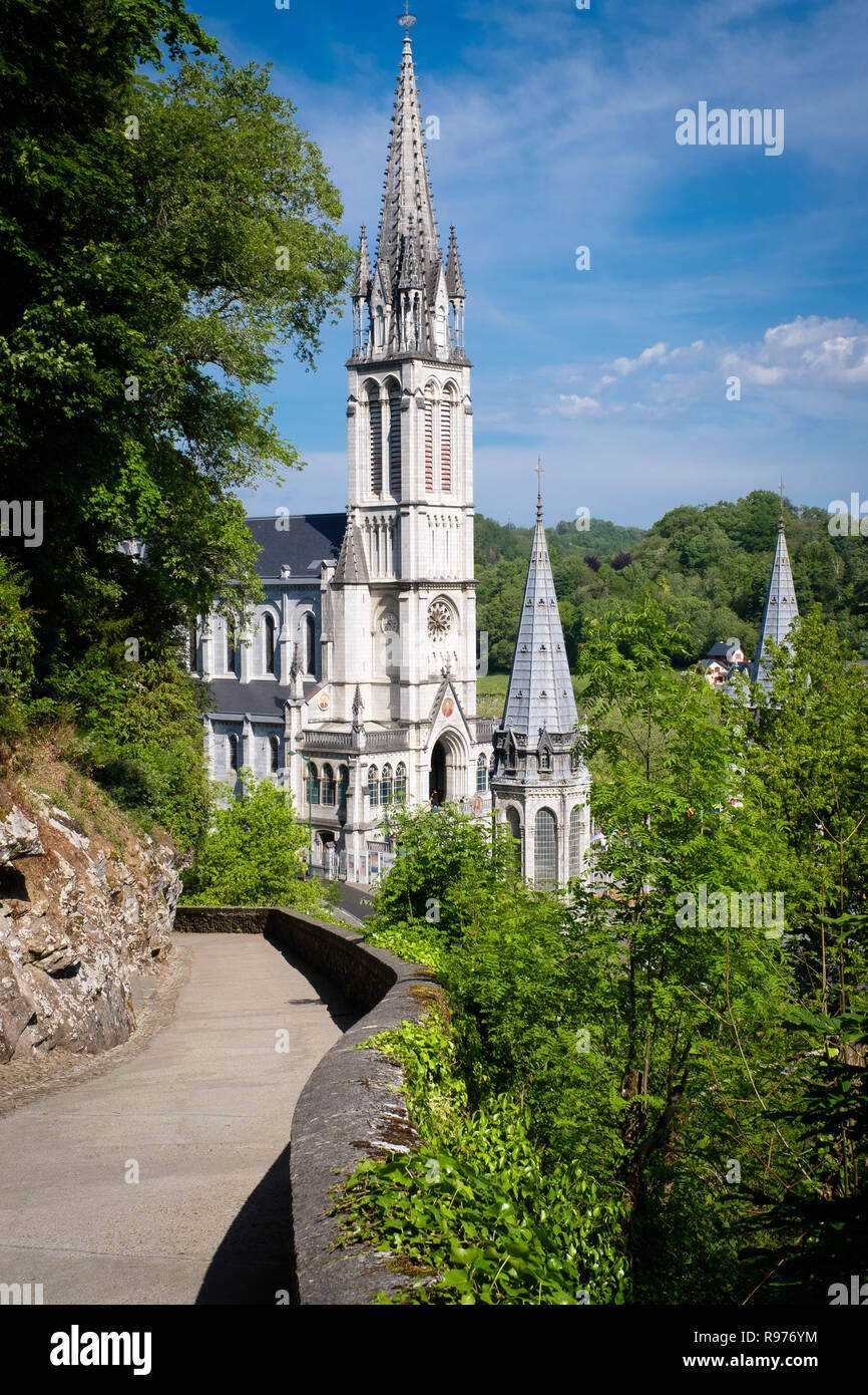 Lourdes (south-western France). 2016/05/20. Sanctuaries most visited pilgrimage shrine in France. The Rosary Basilica (commonly known as the Lower Basilica) and the Basilica of the Immaculate Conception (Upper Basilica), here viewed from the calvary, are situated by the the Gave de Lourdes river within the Sanctuary of our Lady of Lourdes. Stock Photo