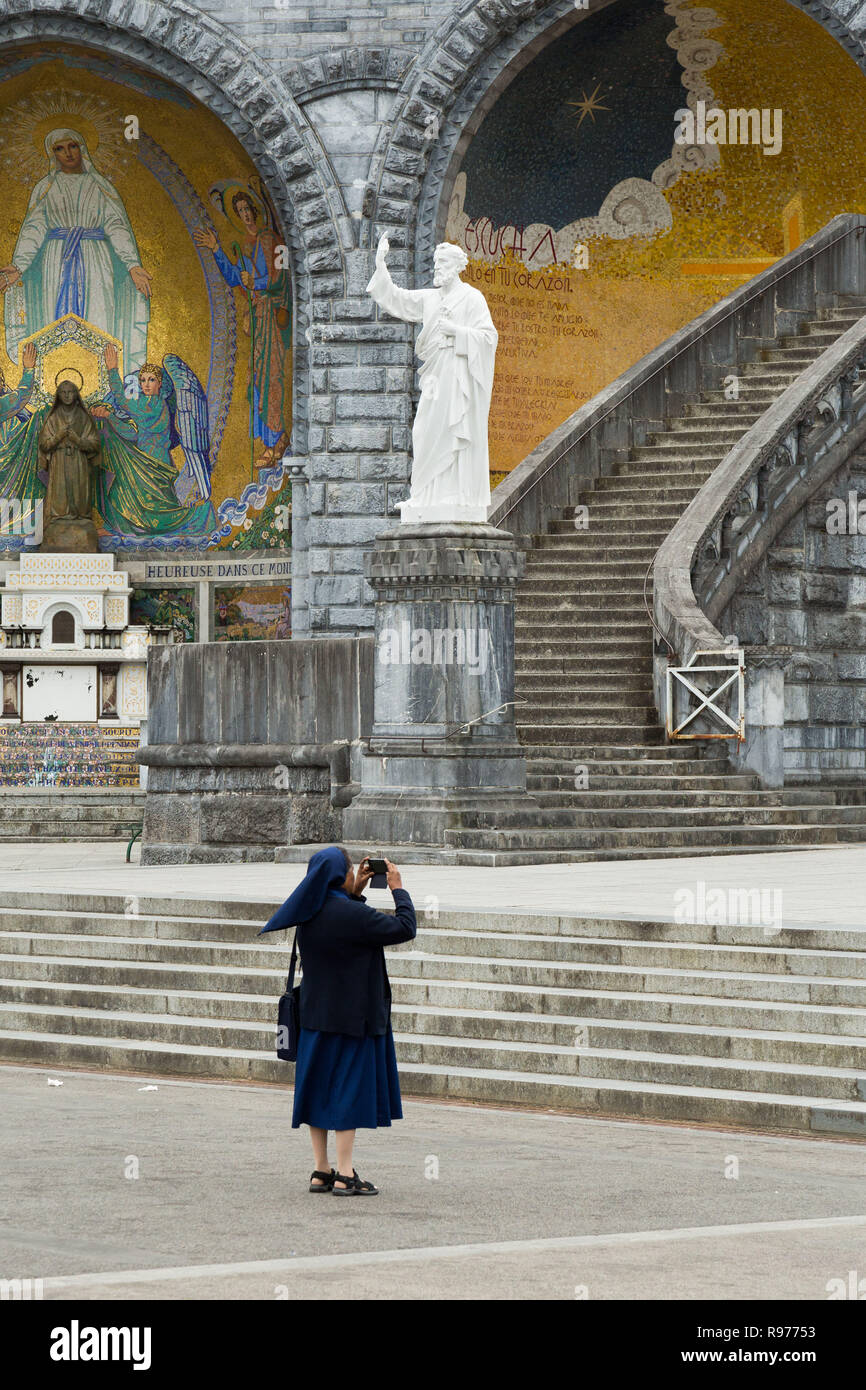 Lourdes interior of the sanctuary of Our Lady of Lourdes and nun