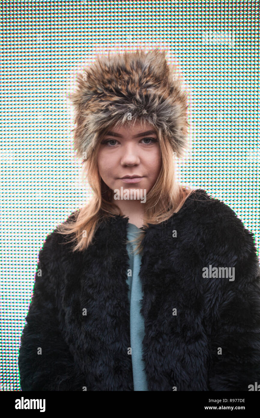 Teenage girl wearing a fur hat in Copenhagen, Sweden Stock Photo