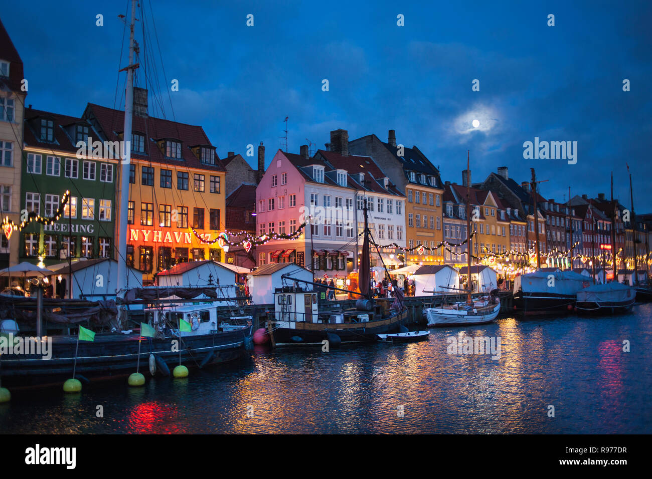The Nyhavn harbor district at night in Copenhagen, Denmark Stock Photo