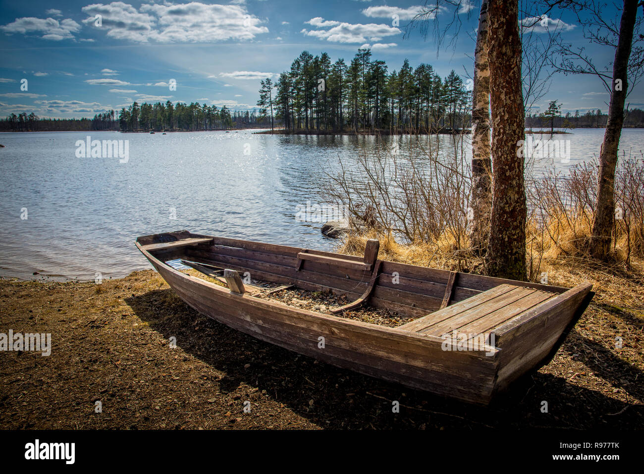 Rowboat by lake in Angelsberg, Sweden Stock Photo