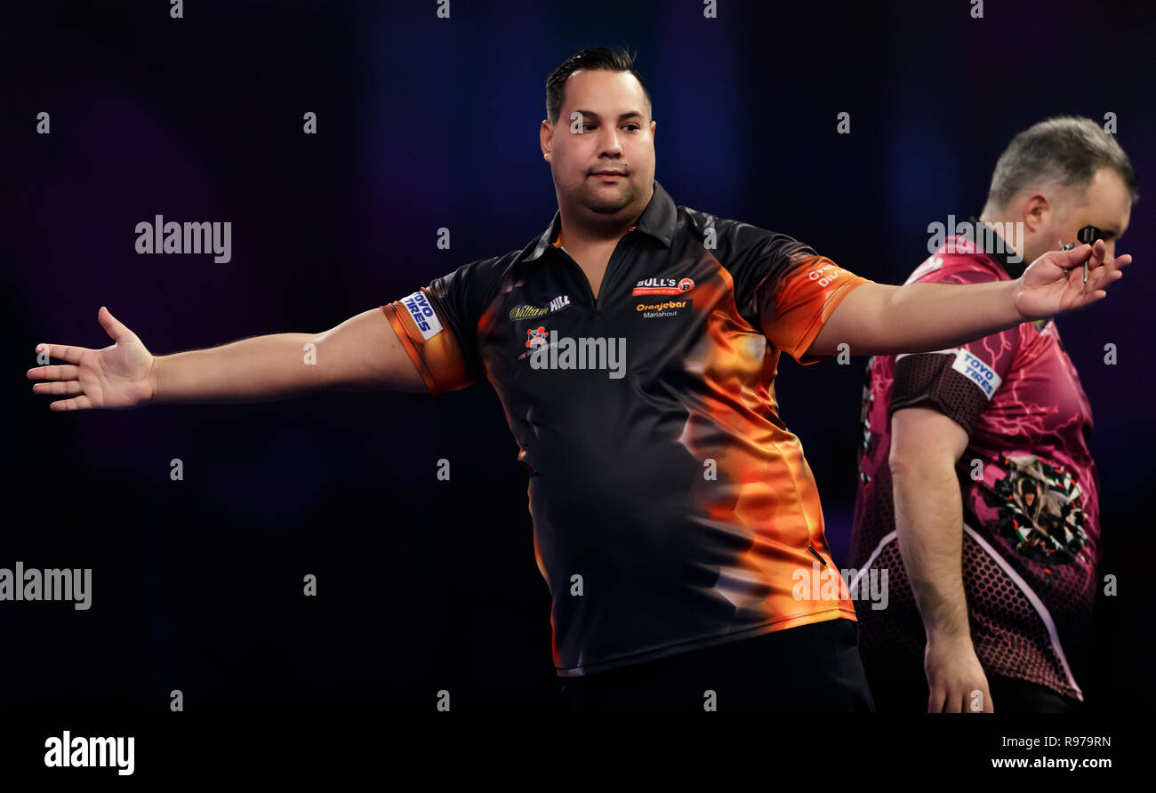 Jermaine Wattimena celebrates during his match against Michael Barnard  during day eight of the William Hill World Darts Championships at Alexandra  Palace, London Stock Photo - Alamy
