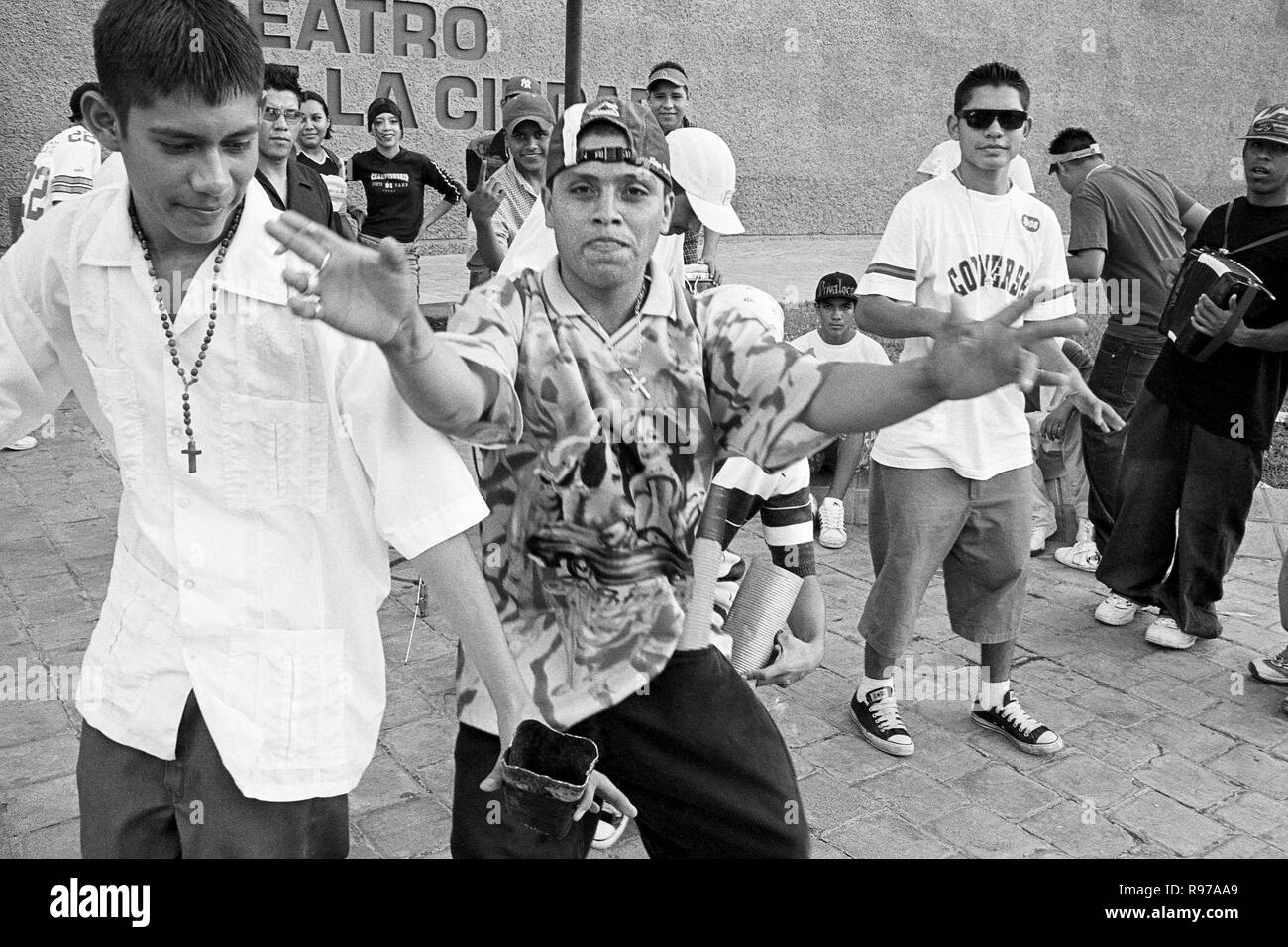 MONTERREY, NL/MEXICO - NOV 2, 2003: A group of young people play and dance Cumbia by the City Theater at the Macroplaza Stock Photo